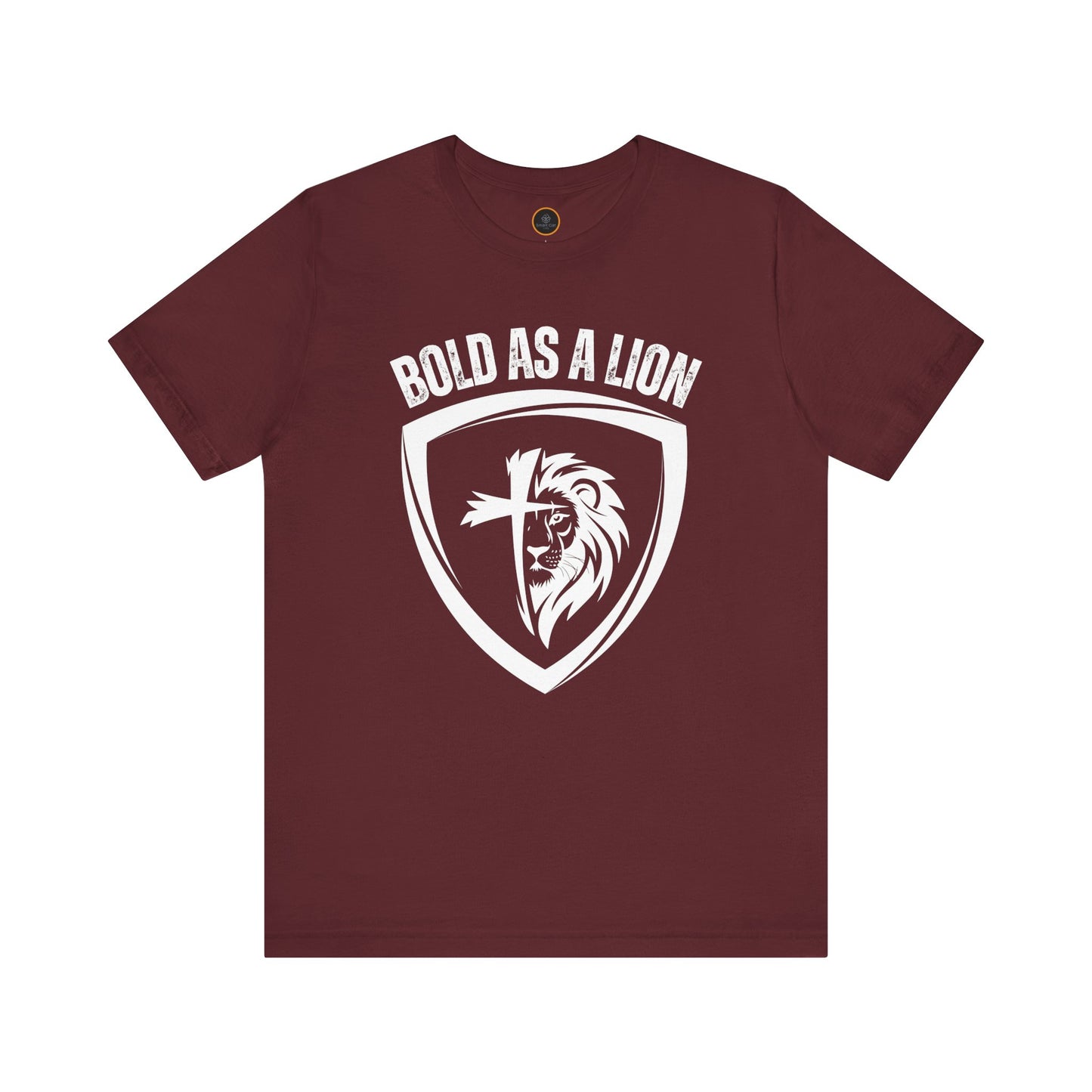 The Bold As A Lion t-shirt: Featuring a graphic with half of a lion's face merging into half of a cross within a shield outline. The text "bold as a lion" is printed above the graphic.