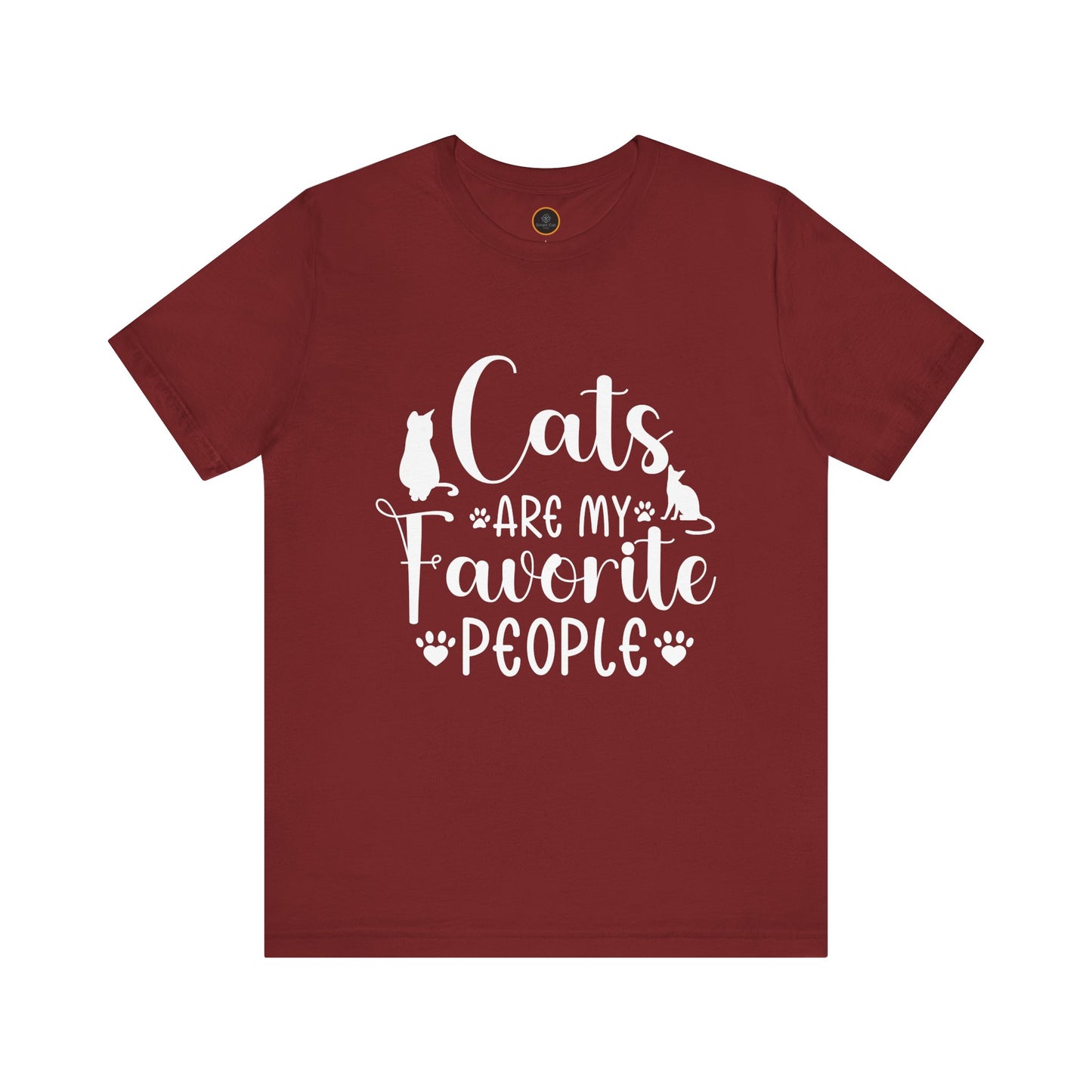 A t-shirt displays the text "Cats are my favorite people" in large letters, complemented by a design of four cat paw prints and two cat silhouettes.