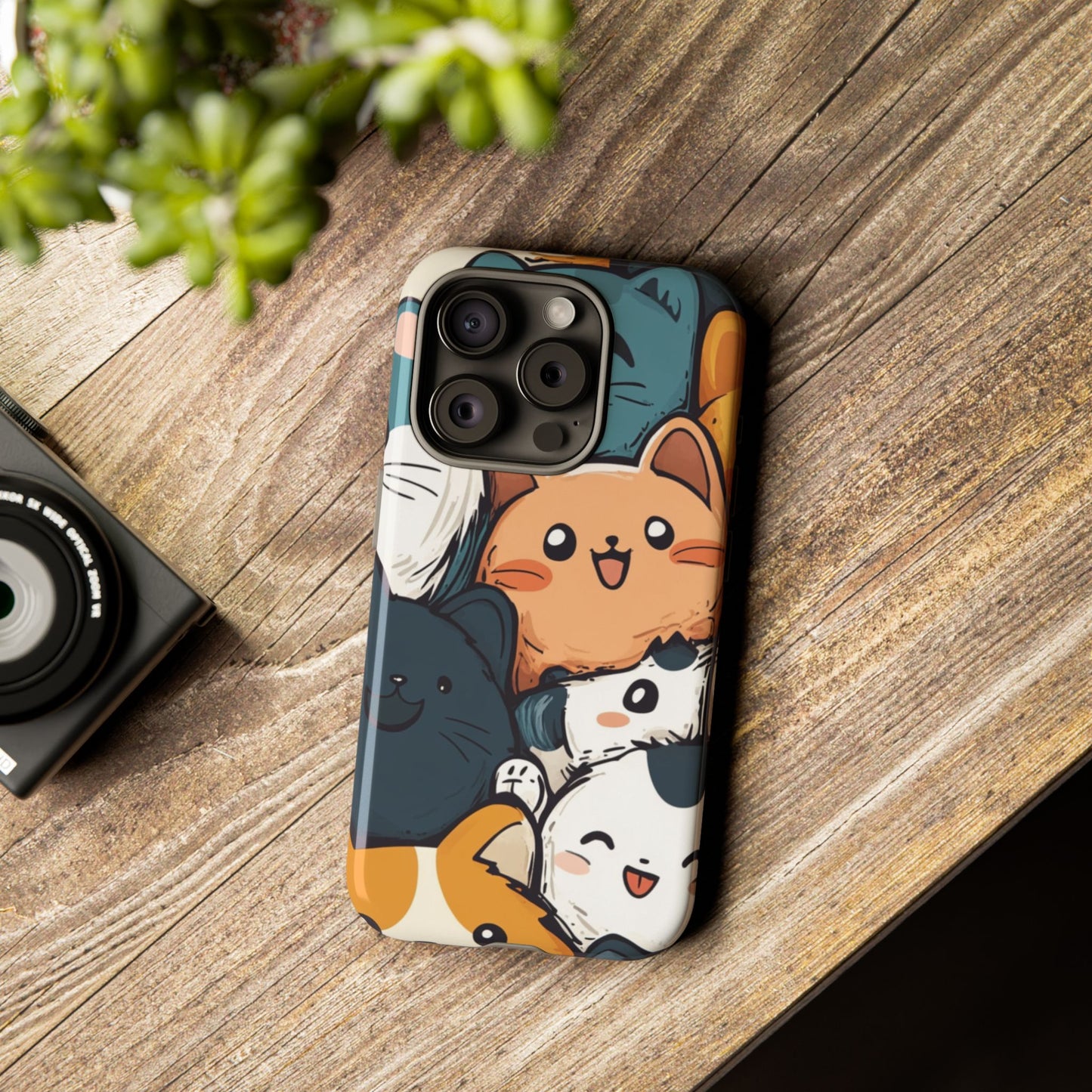 Multi-colored phone case with clustered, smiling Kawaii-style cat faces.