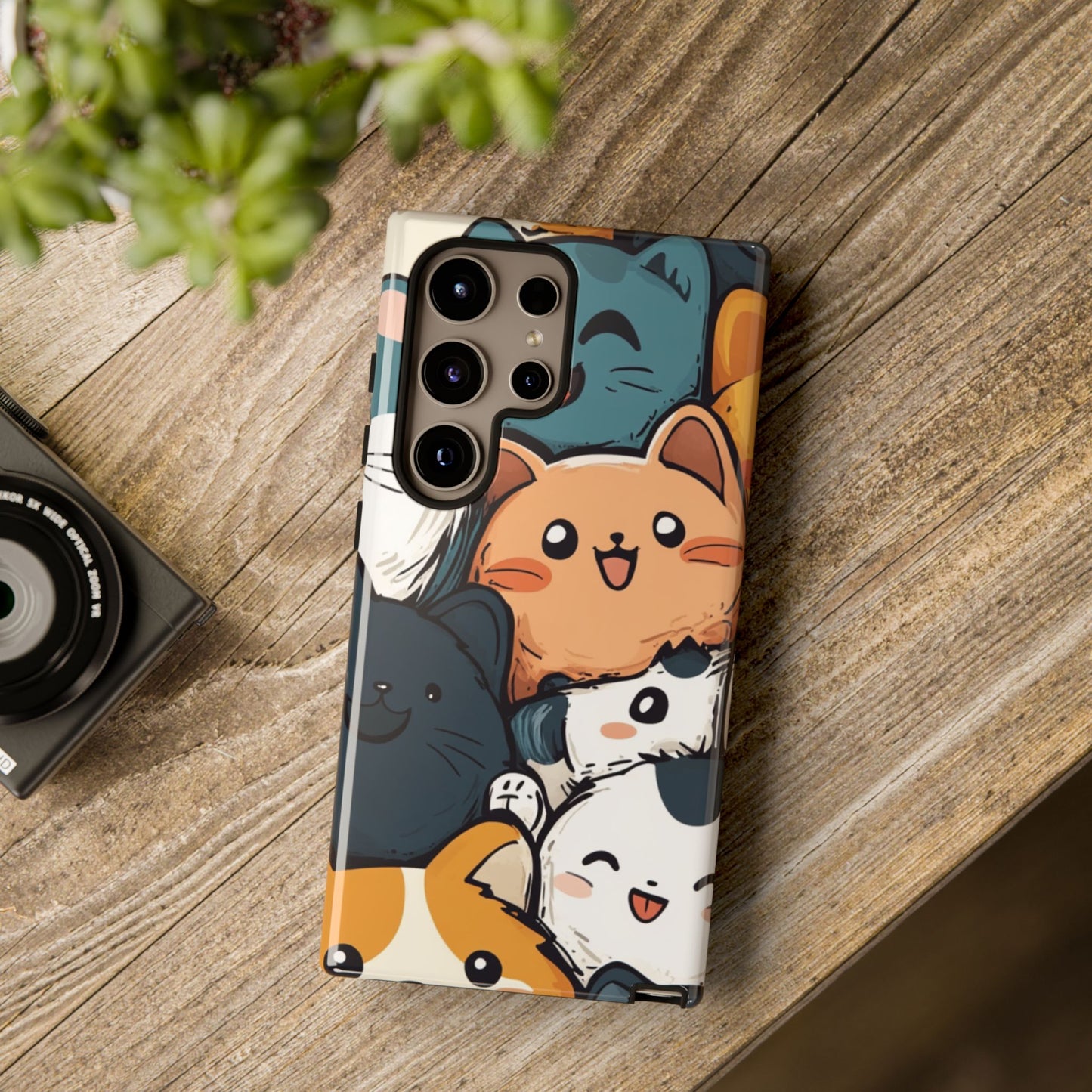 Multi-colored phone case with clustered, smiling Kawaii-style cat faces.