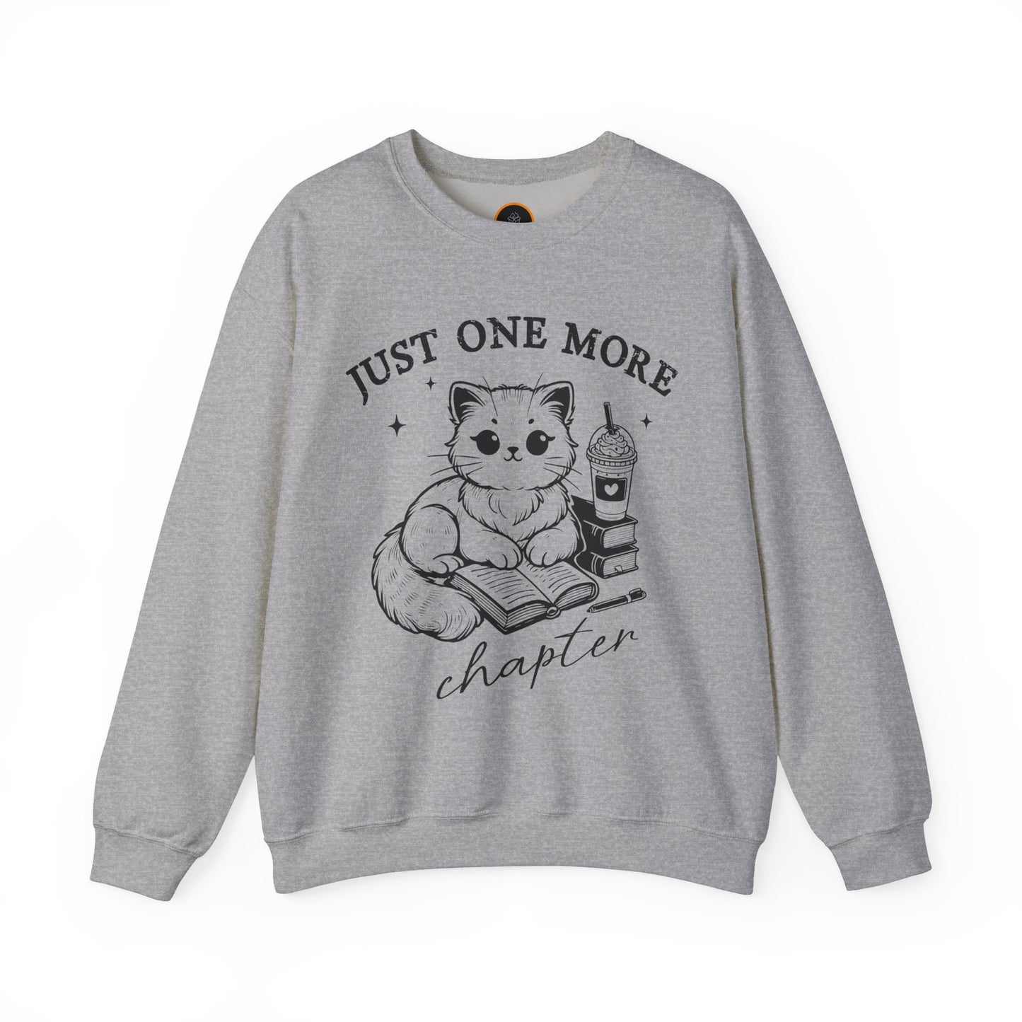 Just One More Chapter" light gray crewneck sweatshirt with a graphic of a cat reading a book next to a Frappuccino on a stack of books.