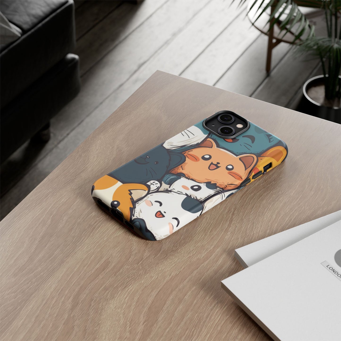 Multi-colored phone case with clustered, smiling Kawaii-style cat faces.