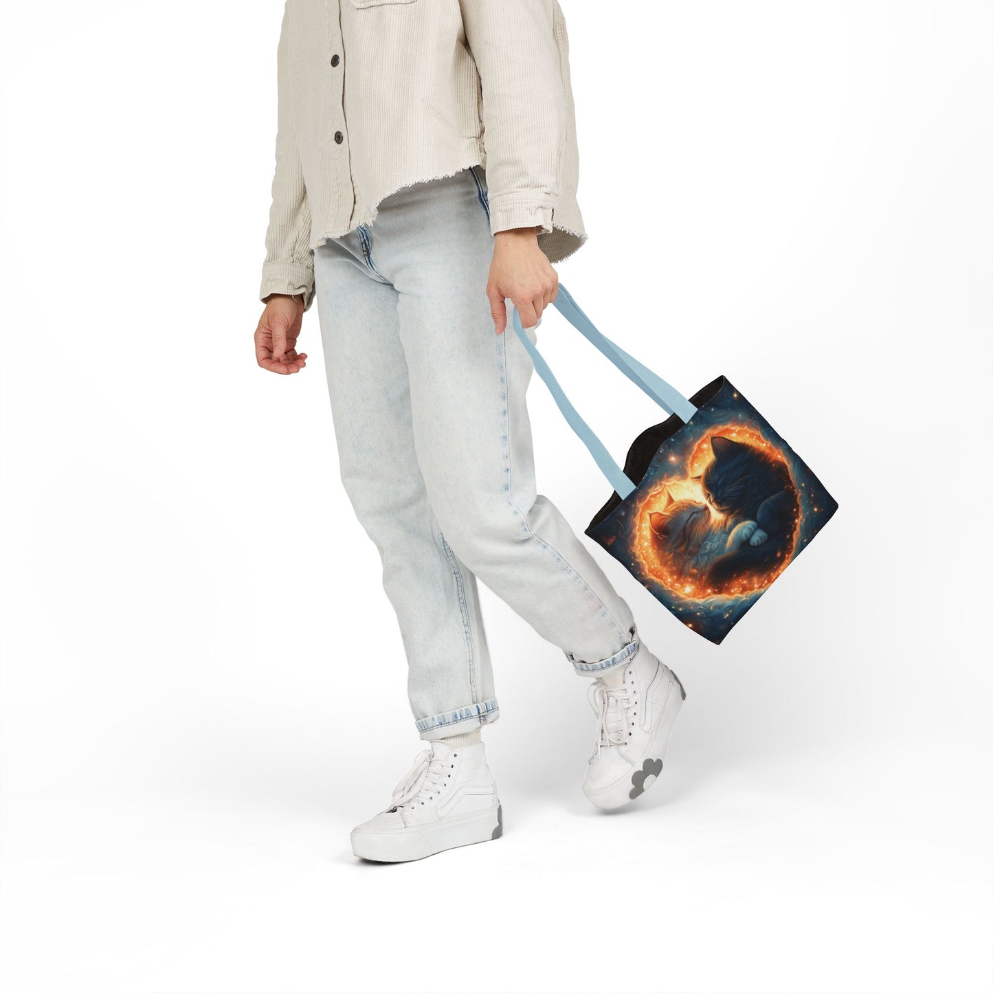 A vibrant heart composed of swirling stardust cradles two cuddling cats against a backdrop of a deep, colorful galaxy. This all-over print design covers the entirety of the Celestial Embrace Tote Bag.