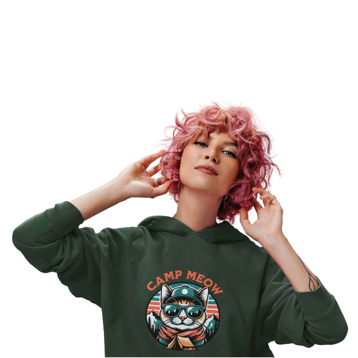 Model wearing the Camp Meow Forest Green Hoodie: Retro illustration of a cat wearing sunglasses and a scout uniform, standing in front of a mountain landscape.