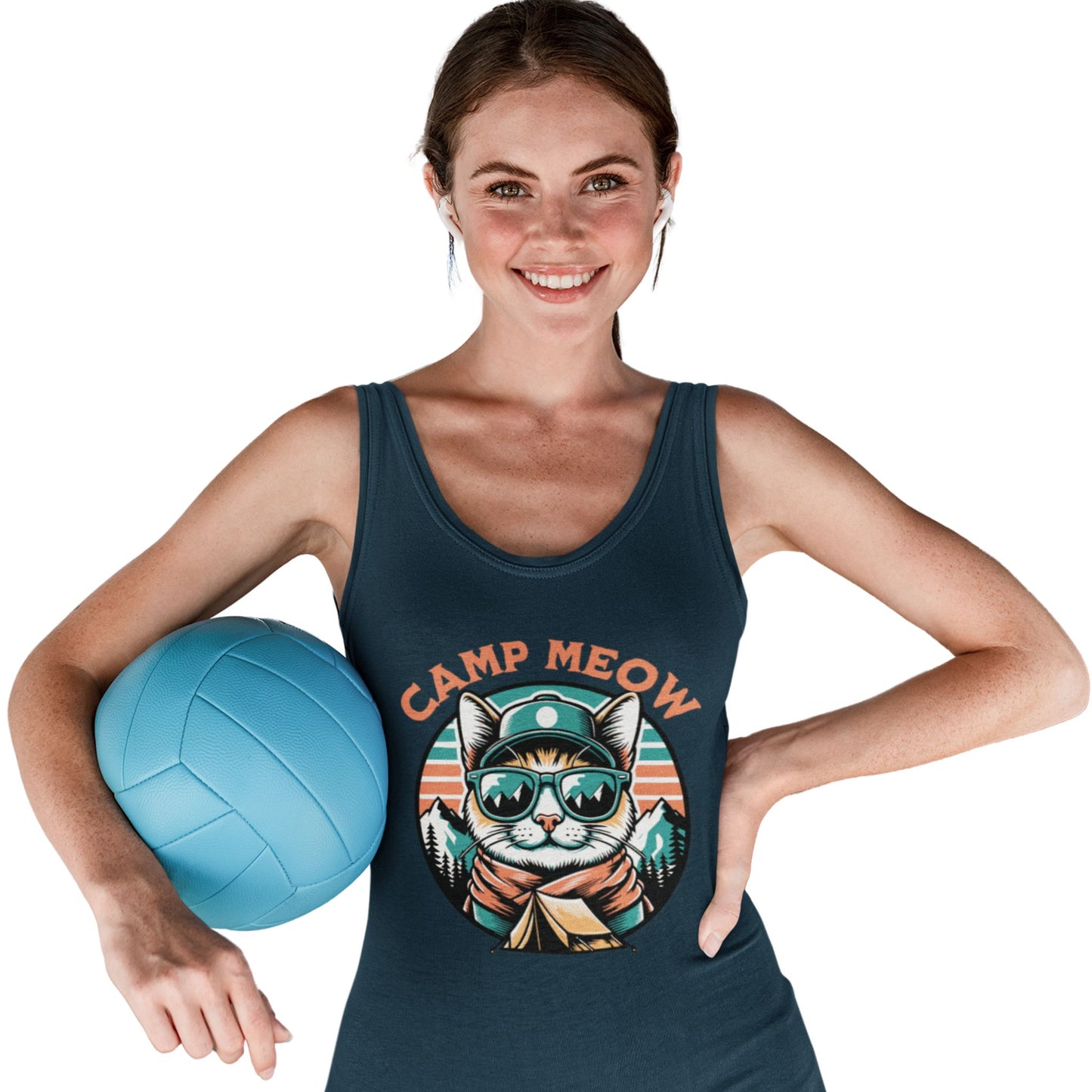 Model holding a volleyball and wearing the Camp Meow Women's Racerback Tank Top: Retro illustration of a cat wearing sunglasses and a scout uniform, standing in front of a mountain landscape.