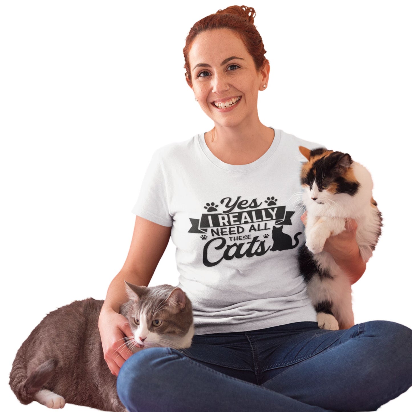 Crew neck t-shirt with a cat graphic, paw graphics and the text 'Yes I Really Need All These Cats' printed on the front.