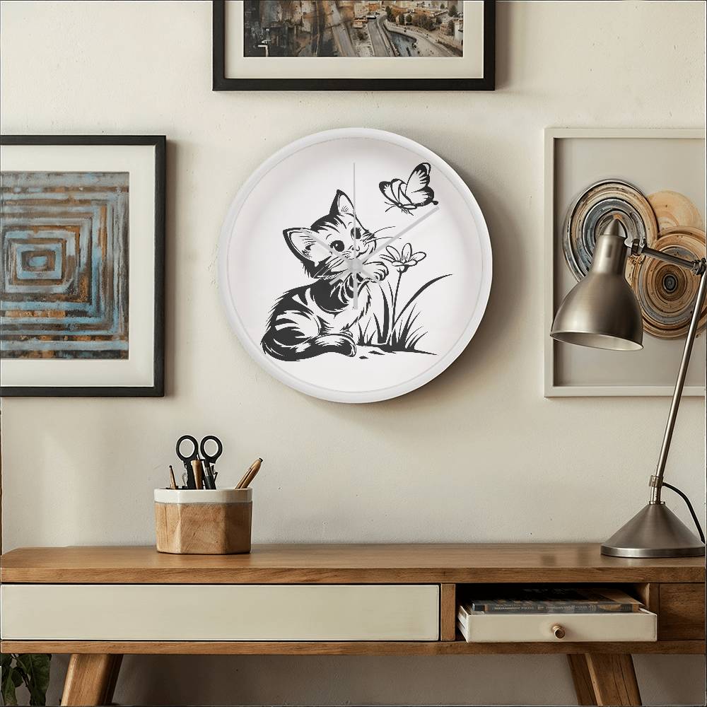 A clock featuring a line art design of a playful encounter between a curious kitten and a gentle butterfly