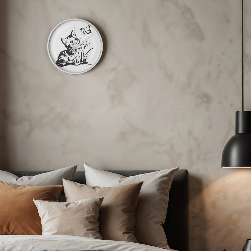 A clock featuring a line art design of a playful encounter between a curious kitten and a gentle butterfly