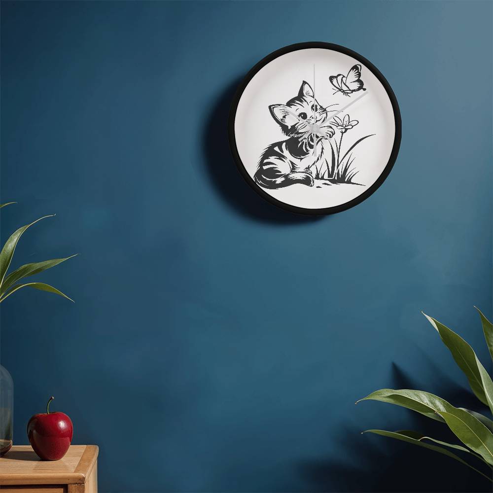A clock featuring a line art design of a playful encounter between a curious kitten and a gentle butterfly