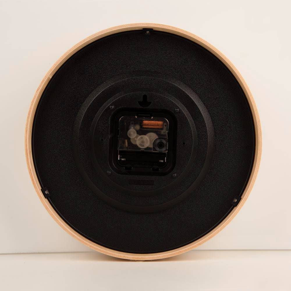 Back view of a clock, showcasing the battery slot and preinstalled hook.
