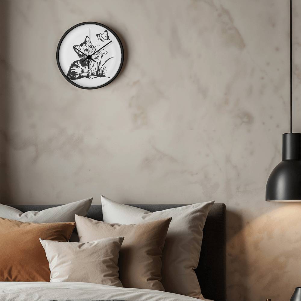 A clock featuring a line art design of a playful encounter between a curious kitten and a gentle butterfly