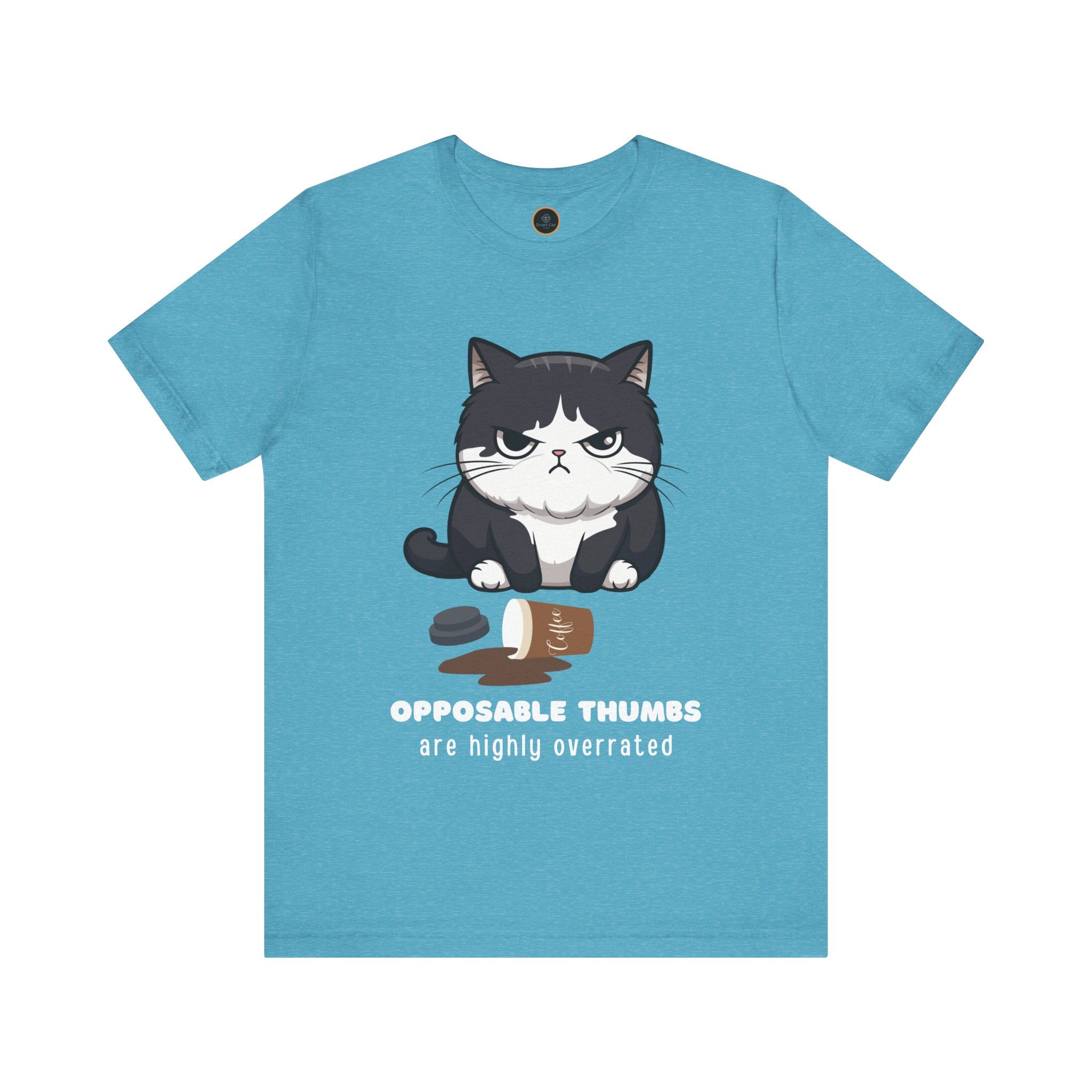 Light blue t-shirt with a graphic of a frustrated cartoon cat standing over spilled coffee. Text below the cat reads "Opposable Thumbs Are Highly Overrated".