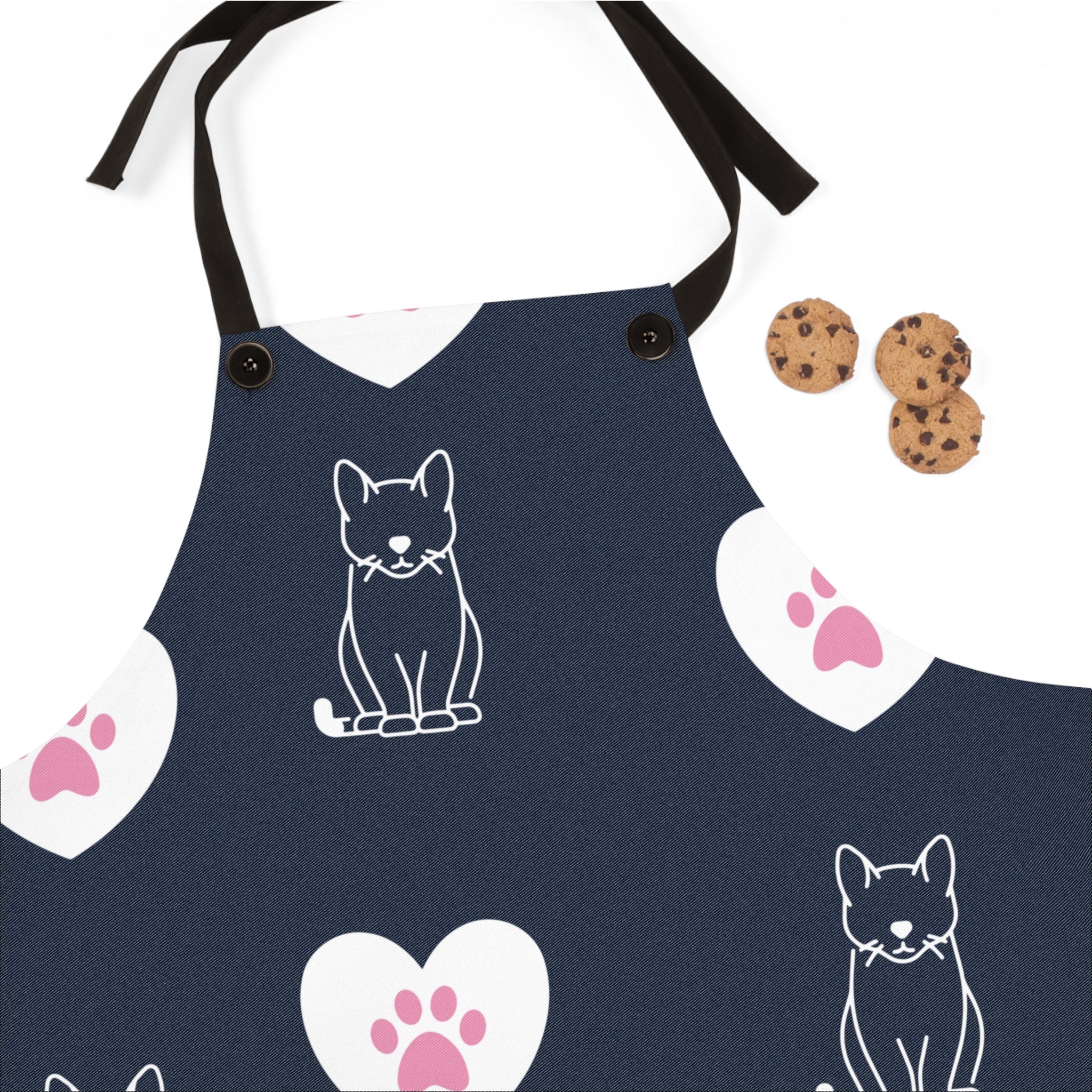 Image of the blue Pink Paws and Hearts apron with a graphic of pink cat paws in white hearts surrounded by line art house cats.