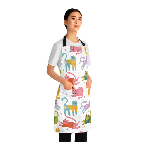 Model wearing a white apron with colorful cat patterns on a white background