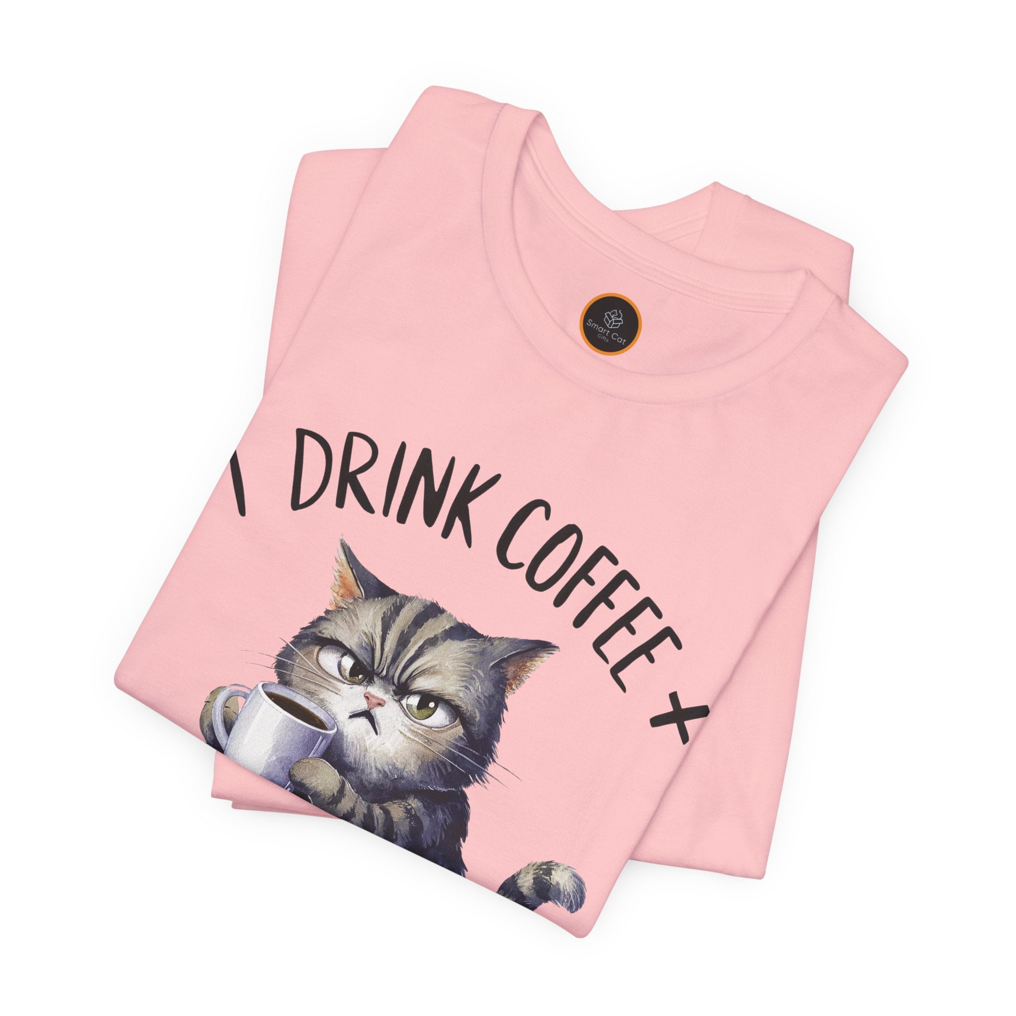 A crew neck t-shirt with the text 'I DRINK COFFEE AND I KNOW THINGS' and an illustration of grumpy a cat holding a coffee cup.