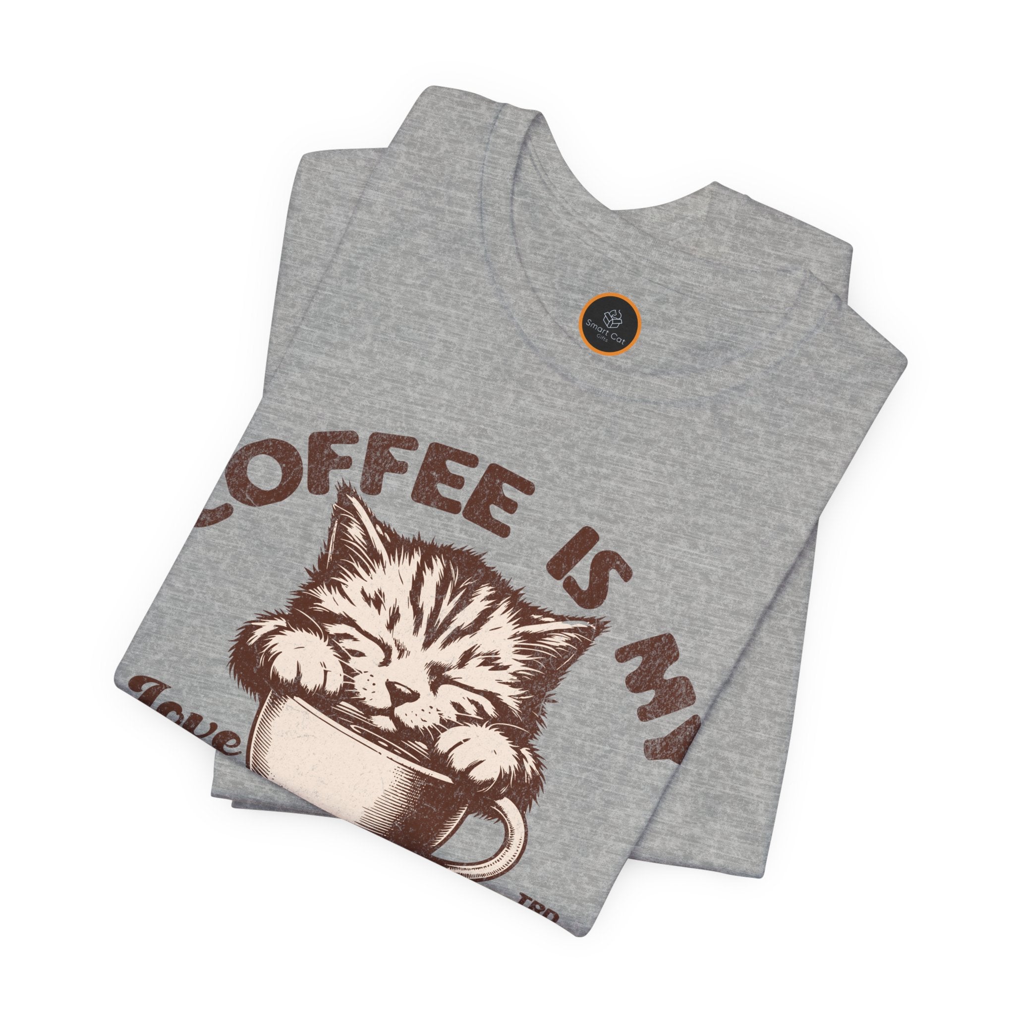 A  crew neck t-shirt with the text 'COFFEE IS MY LANGUAGE' and a graphic of a cat.
