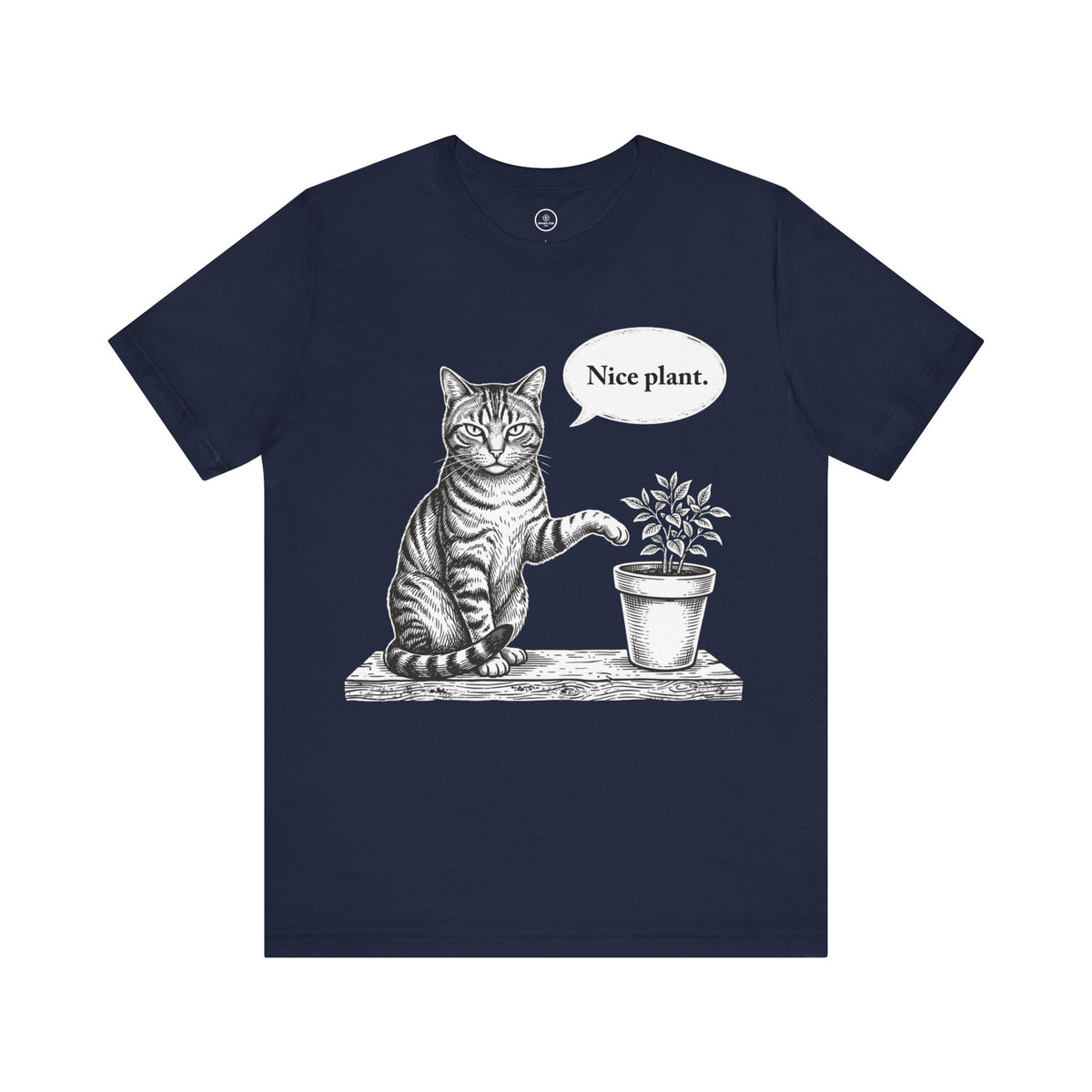 A navy blue short-sleeve crewneck t-shirt featuring a black and white graphic of a cat sitting next to a potted plant with a speech bubble that says 'Nice plant.'.