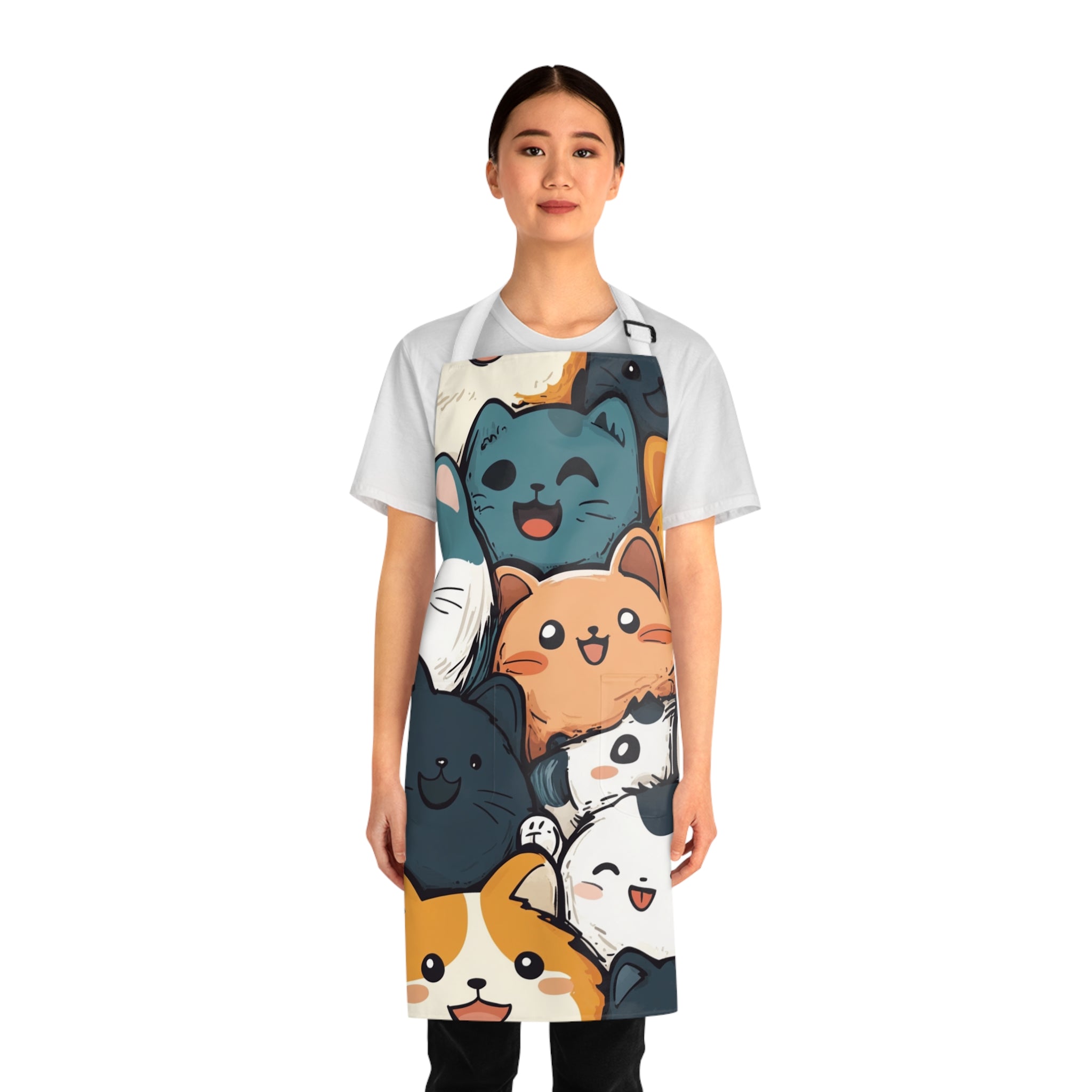 Woman wearing a colorful apron with cartoon cat designs