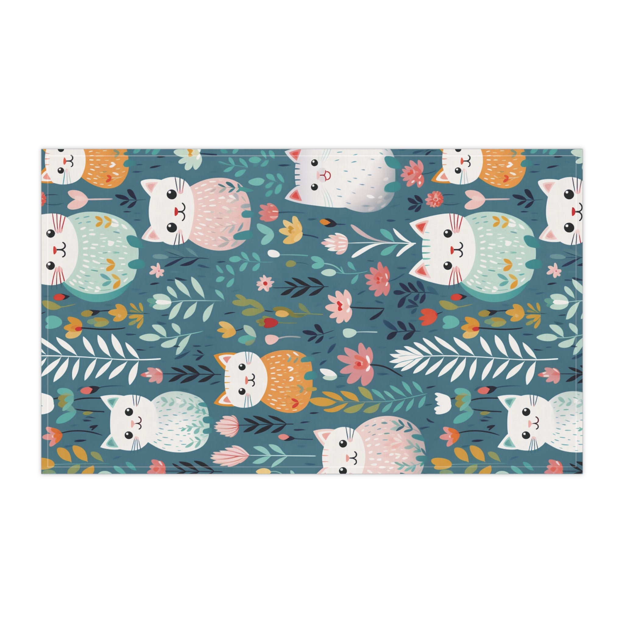 Image of the teal colored Flower Kitty tea towel with a graphic of smiling cats surrounded by flowers.