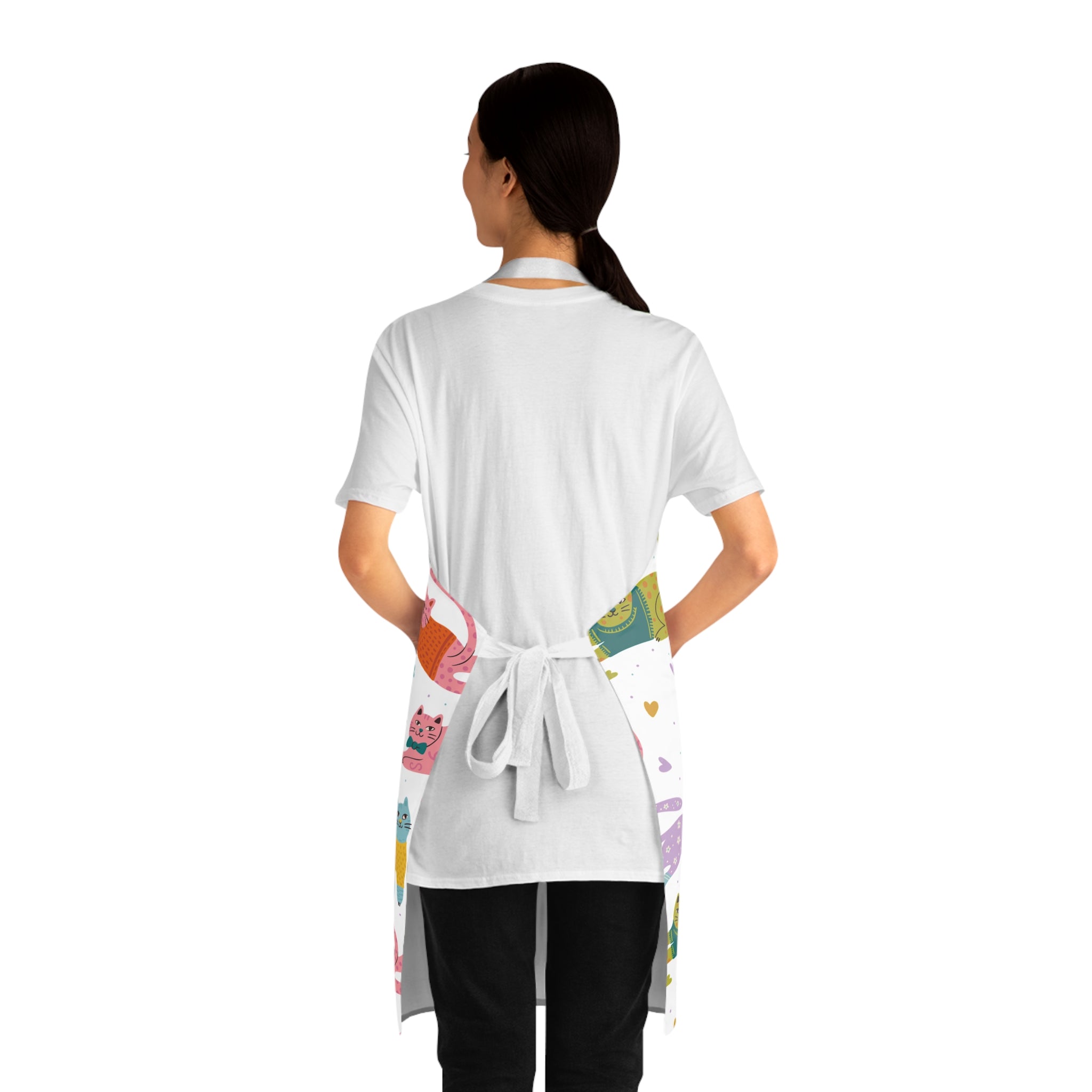 Back view of a model wearing a white apron with colorful designs on a white background