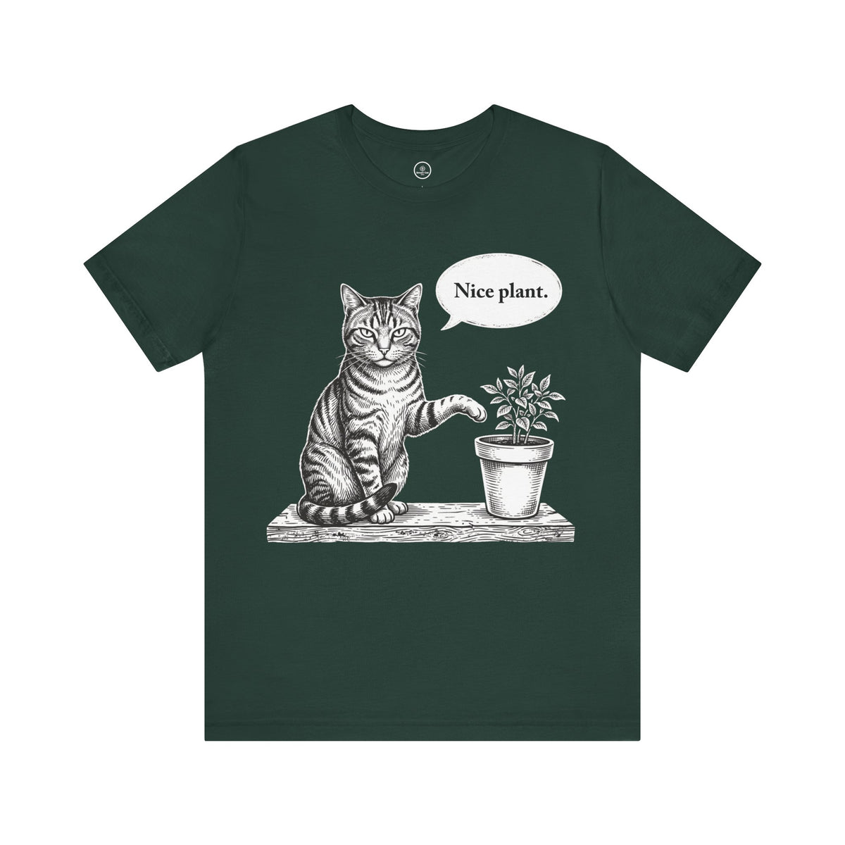 A forest green short-sleeve t-shirt with a black and white graphic of a cat sitting next to a potted plant and saying 'Nice plant.' in a speech bubble, shown on a plain white background.