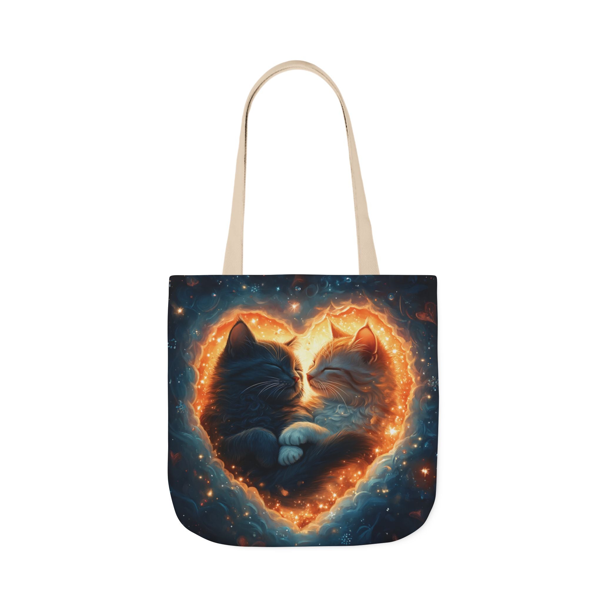 A vibrant heart composed of swirling stardust cradles two cuddling cats against a backdrop of a deep, colorful galaxy. This all-over print design covers the entirety of the Celestial Embrace Tote Bag.