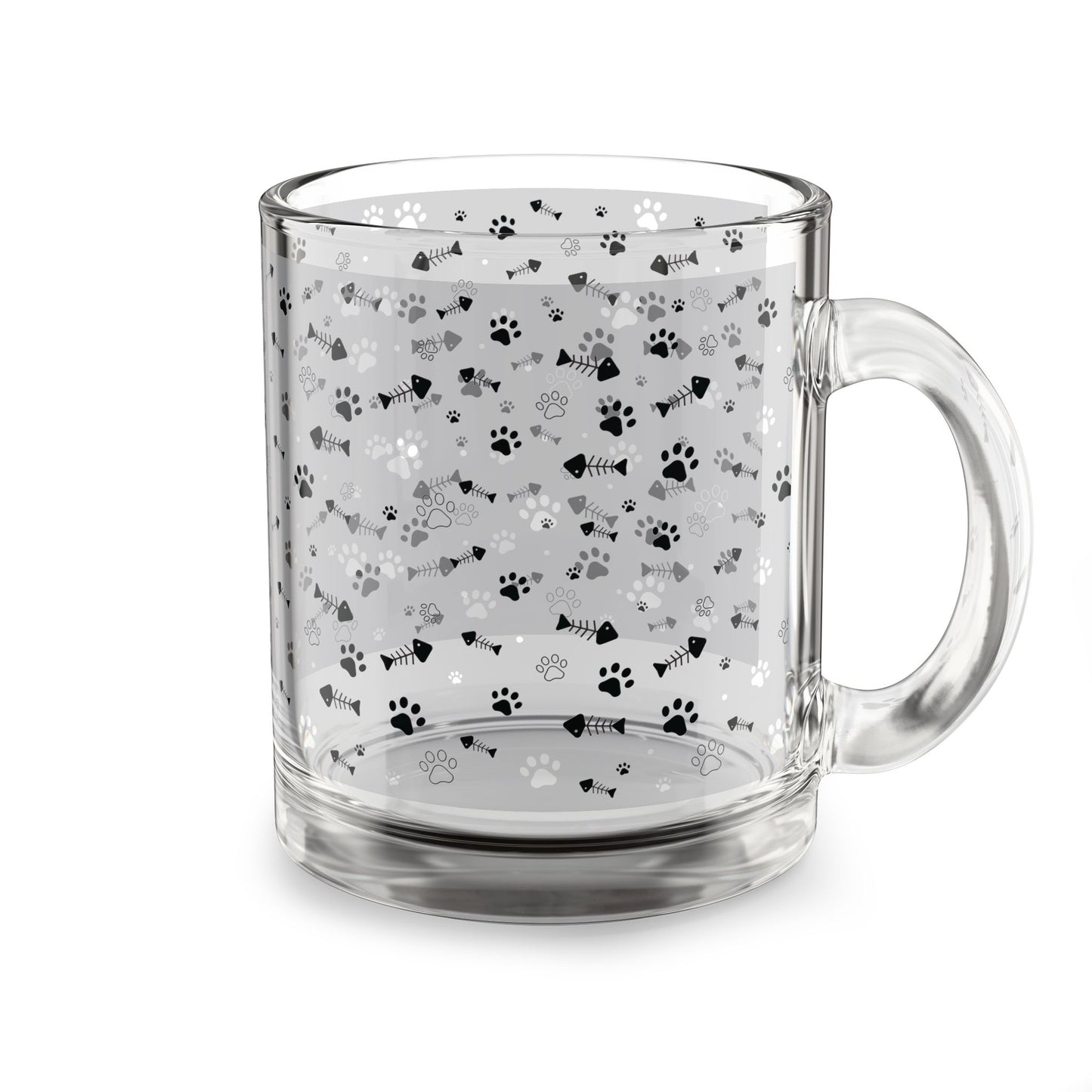 Clear glass mug with paw prints and fishbones all over print pattern.