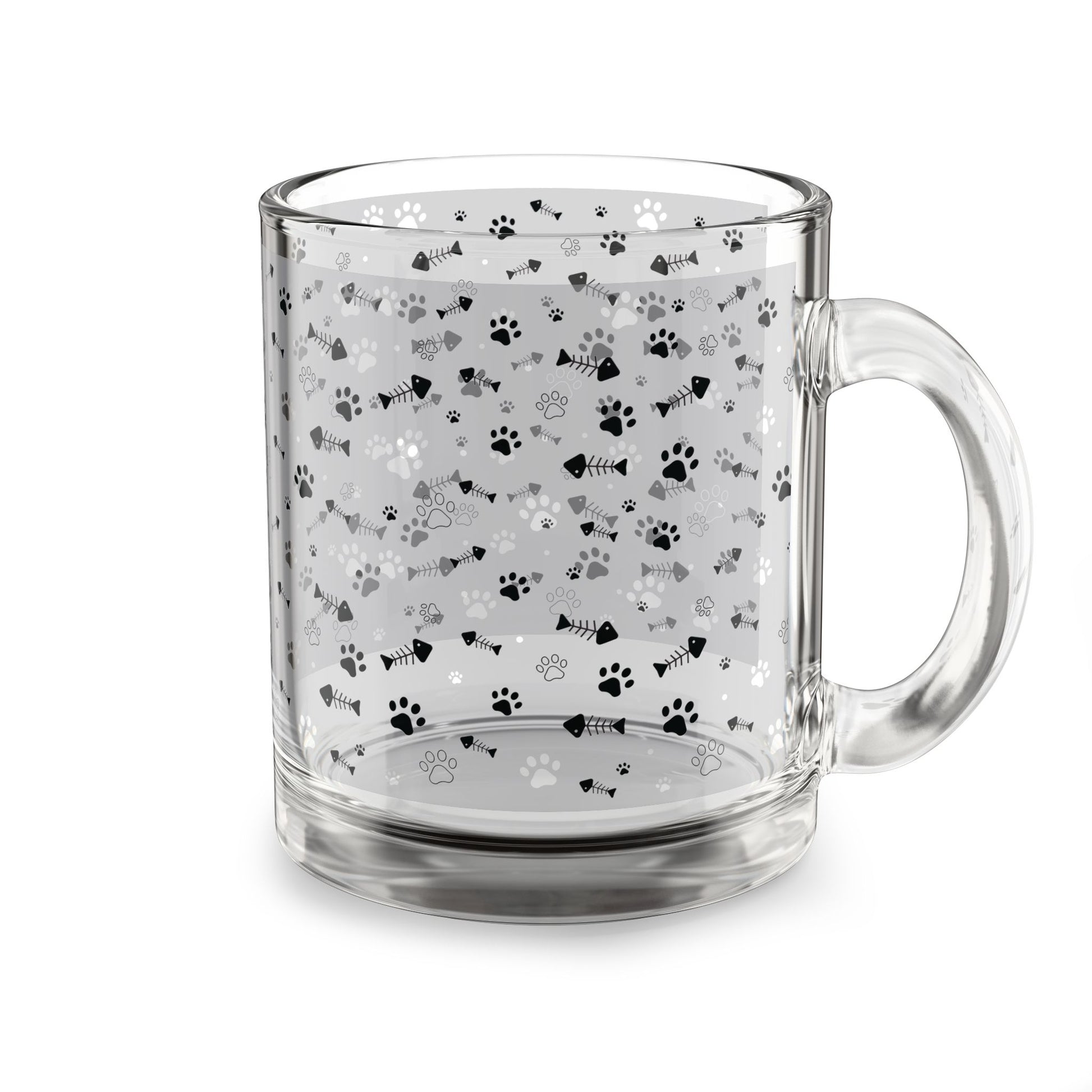 Clear glass mug with paw prints and fishbones all over print pattern.