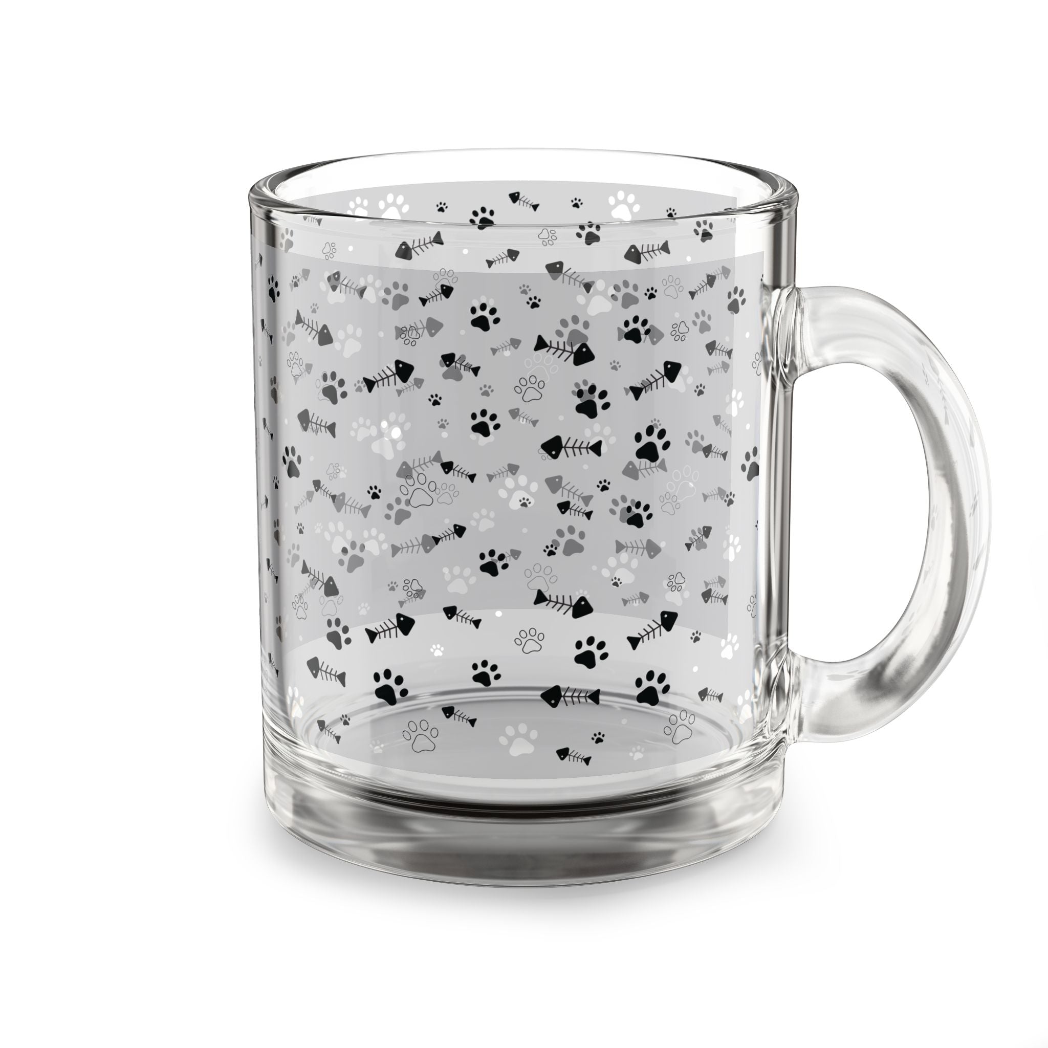 Clear glass mug with paw prints and fishbones all over print pattern.