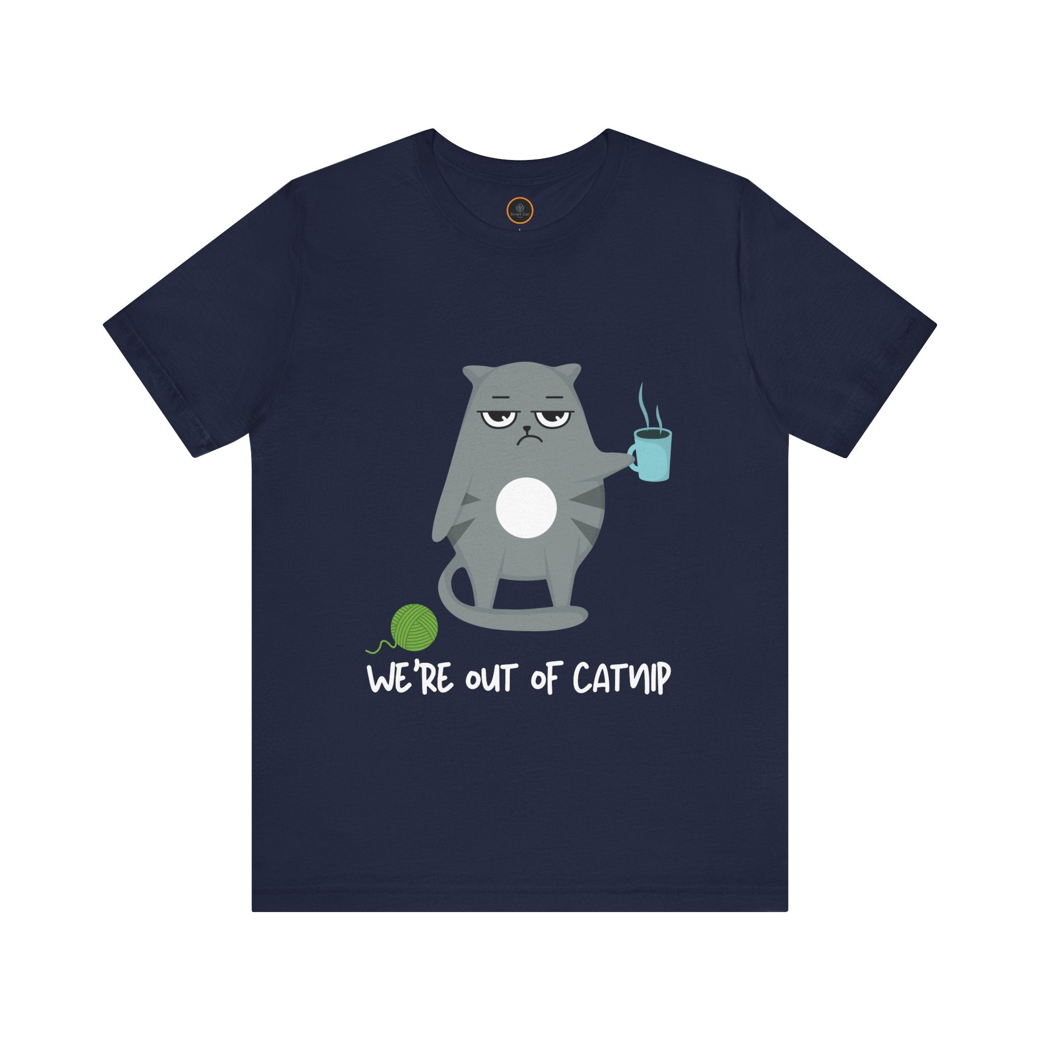 Crewneck t-shirt featuring a cartoon gray and white cat smugly holds a steaming cup of coffee. A green ball of yarn sits on the floor nearby. Below the image, the text reads "We're Out Of Catnip".