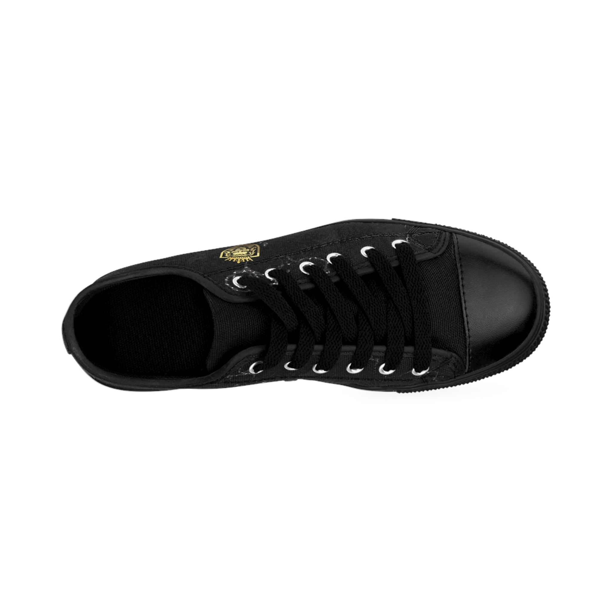 Top view of the Majestic Paw men's sneakers, black low top, gold lion and crown emblem on the side.