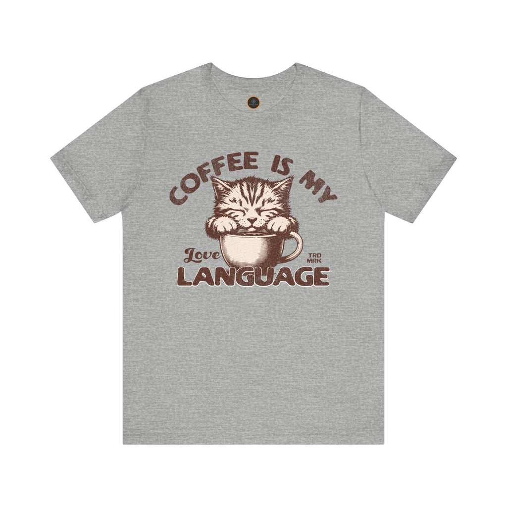 A  crew neck t-shirt with the text 'COFFEE IS MY LANGUAGE' and a graphic of a cat.