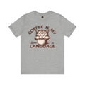 A  crew neck t-shirt with the text 'COFFEE IS MY LANGUAGE' and a graphic of a cat.