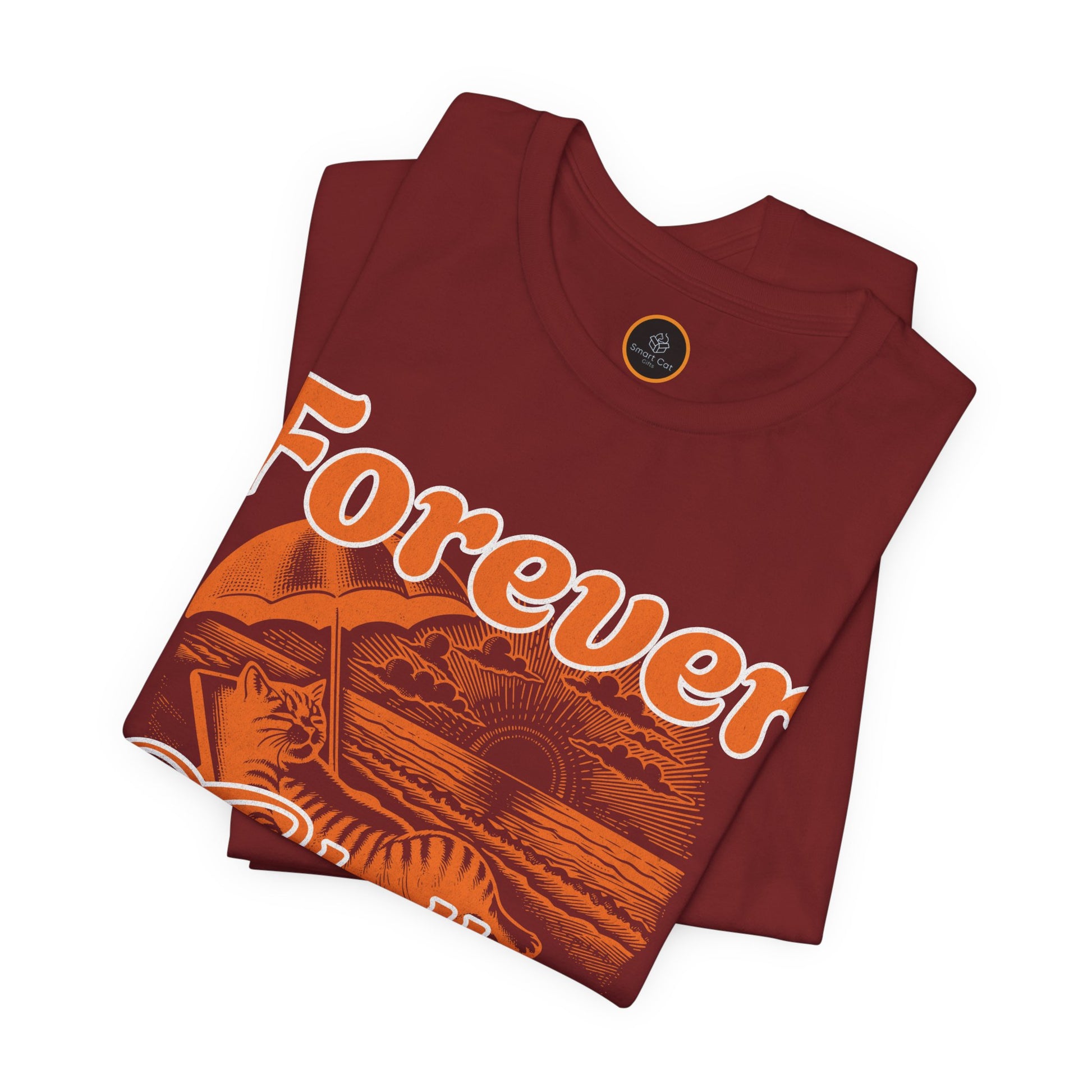 A graphic on the "Forever Chillin'" T-shirt shows a relaxed cat lounging in a beach chair on a sandy beach, with ocean waves and a setting sun visible in the background.