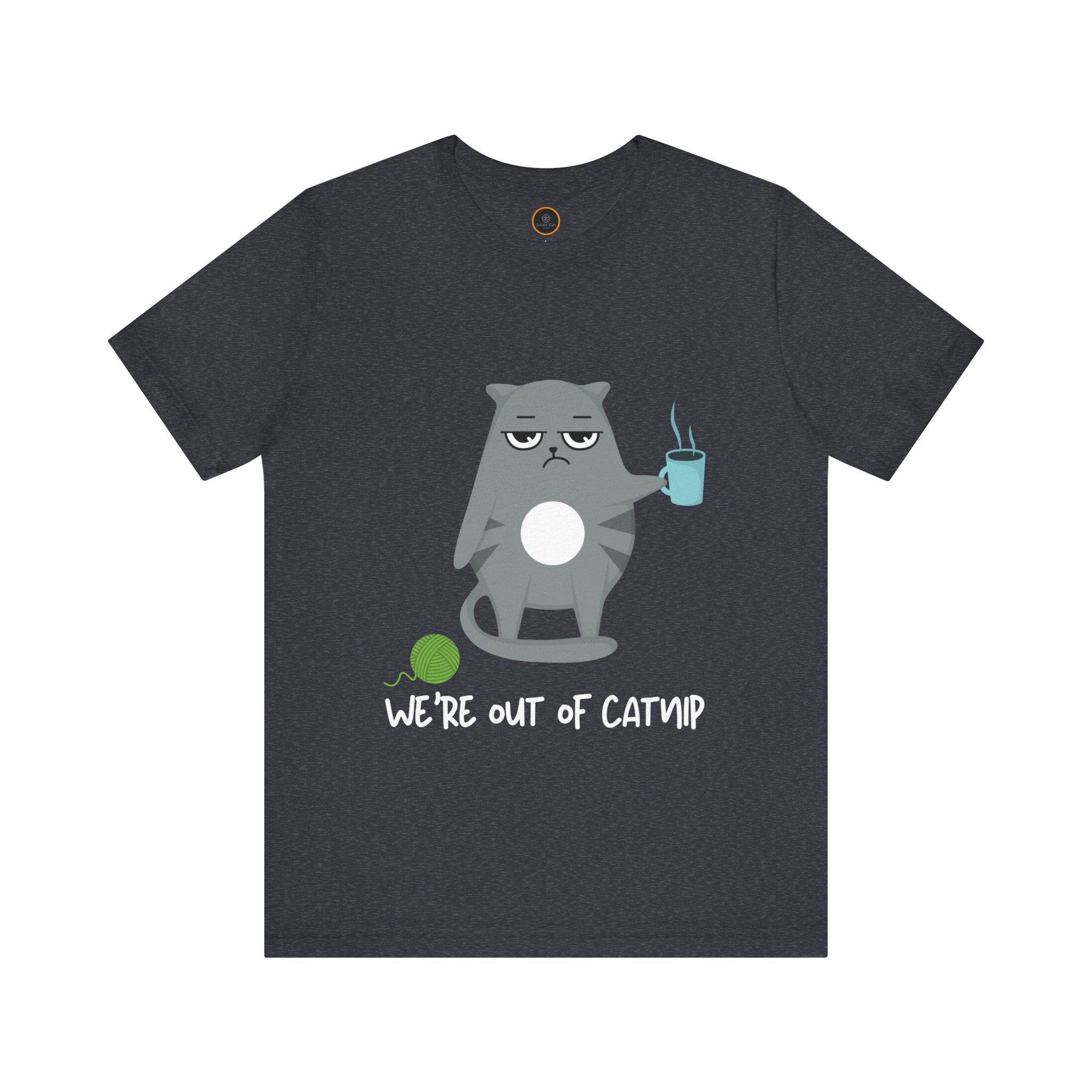 Crewneck t-shirt featuring a cartoon gray and white cat smugly holds a steaming cup of coffee. A green ball of yarn sits on the floor nearby. Below the image, the text reads "We're Out Of Catnip".