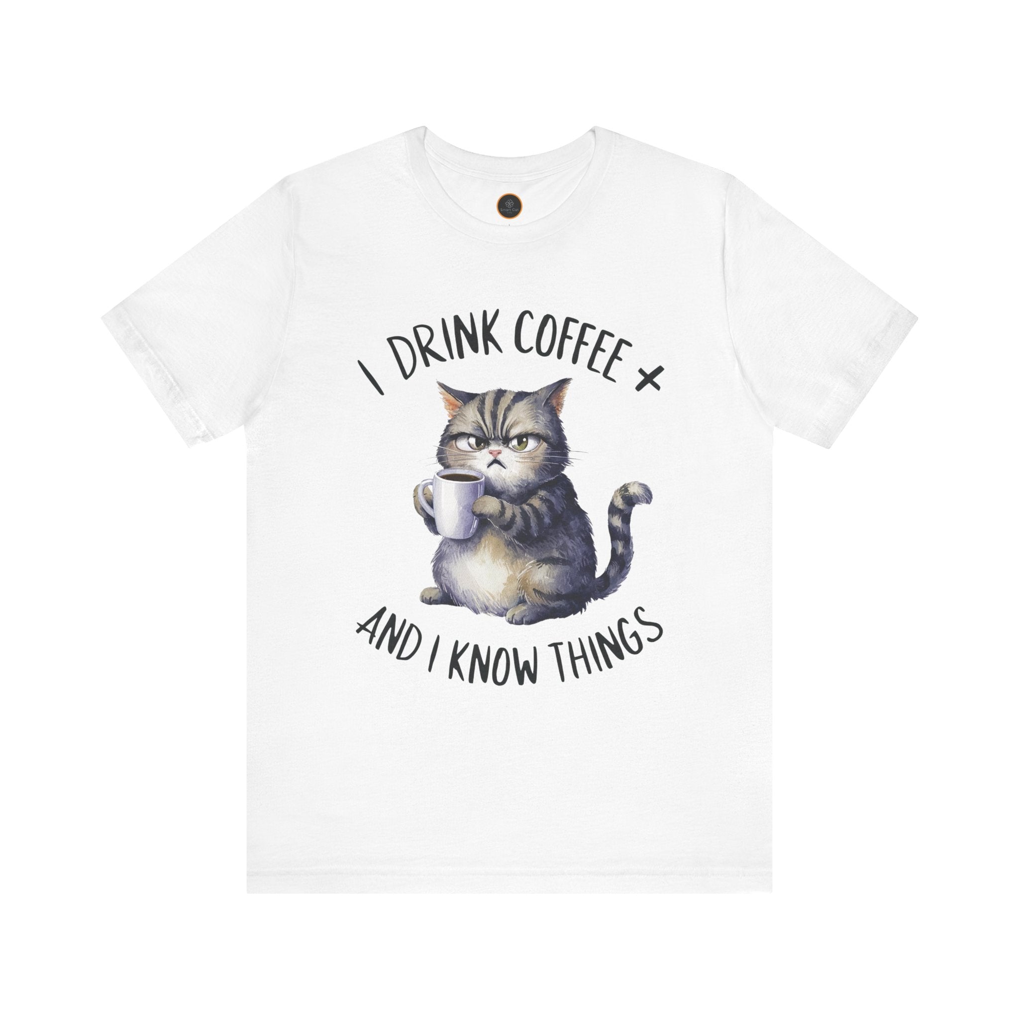 A crew neck t-shirt with the text 'I DRINK COFFEE AND I KNOW THINGS' and an illustration of grumpy a cat holding a coffee cup.