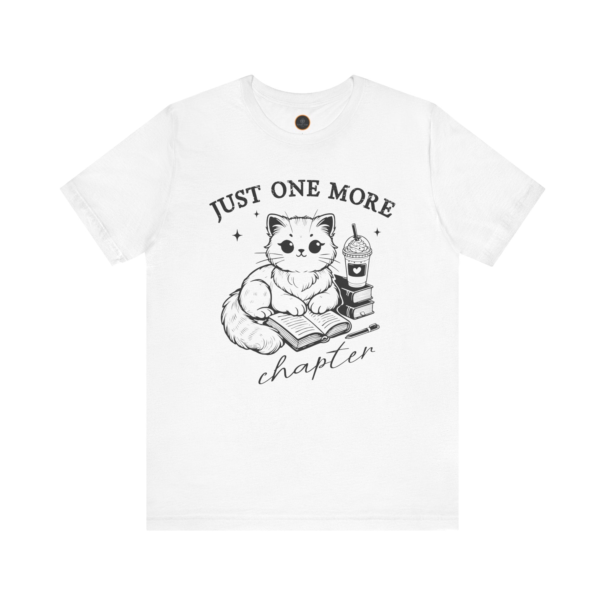 The "Just One More Chapter" t-shirt depicting a cat reading an open book beside a book stack topped with a beverage. The words "just one more" are above, and "chapter" in script is below.