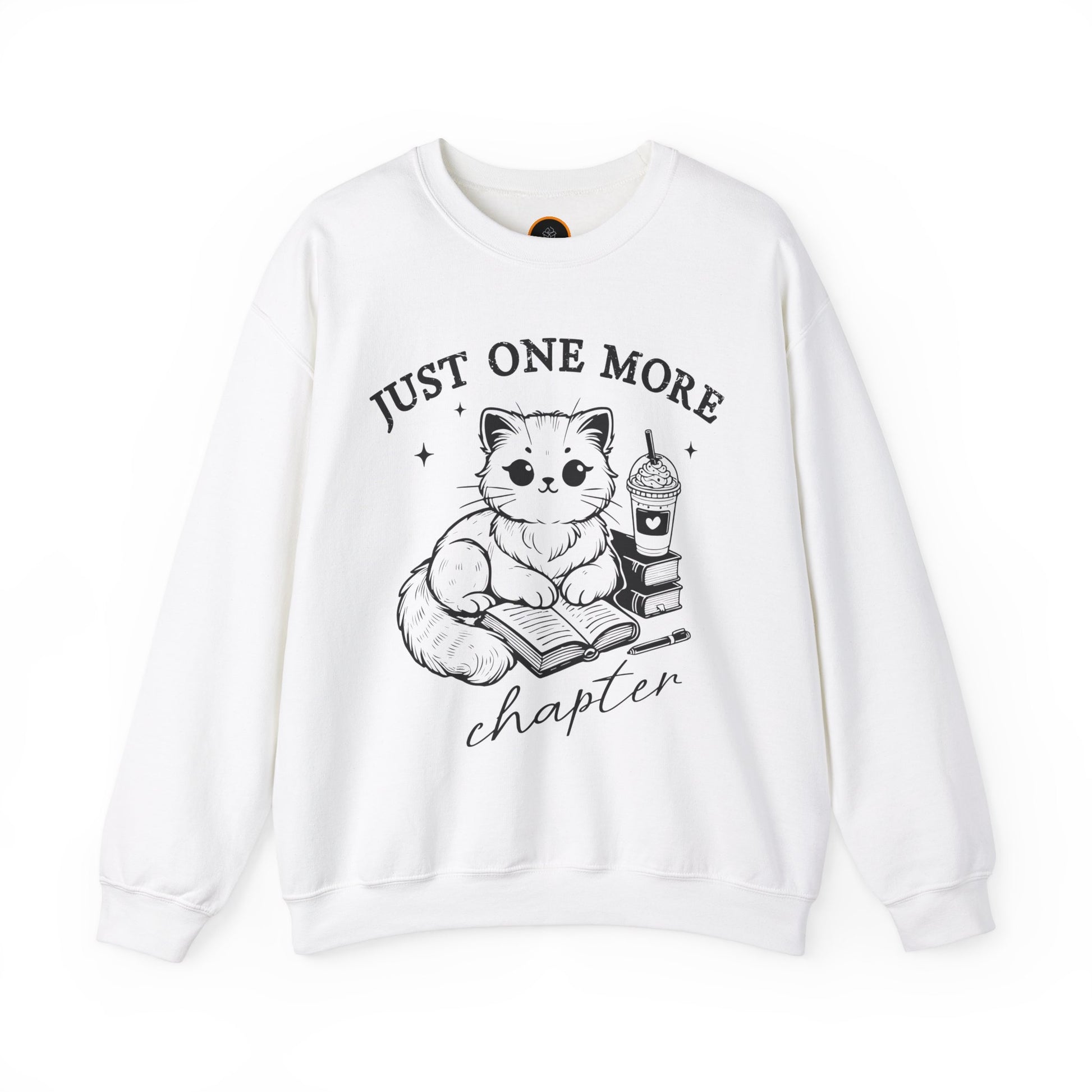 Just One More Chapter" light gray crewneck sweatshirt with a graphic of a cat reading a book next to a Frappuccino on a stack of books.