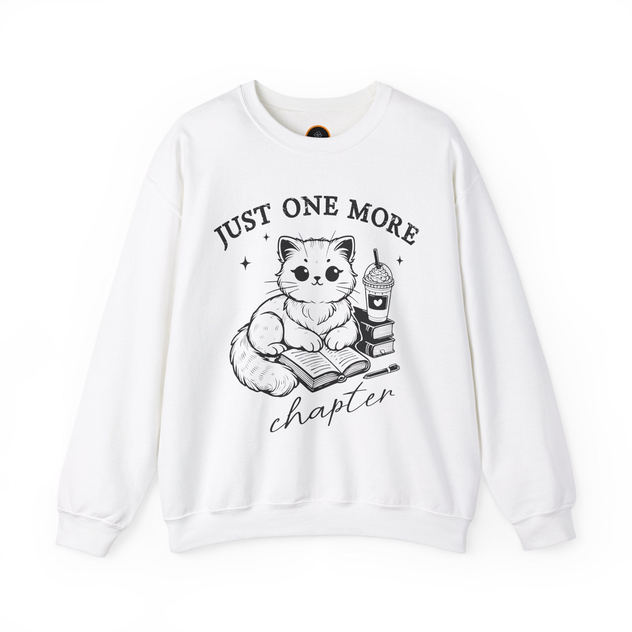 Just One More Chapter" light gray crewneck sweatshirt with a graphic of a cat reading a book next to a Frappuccino on a stack of books.