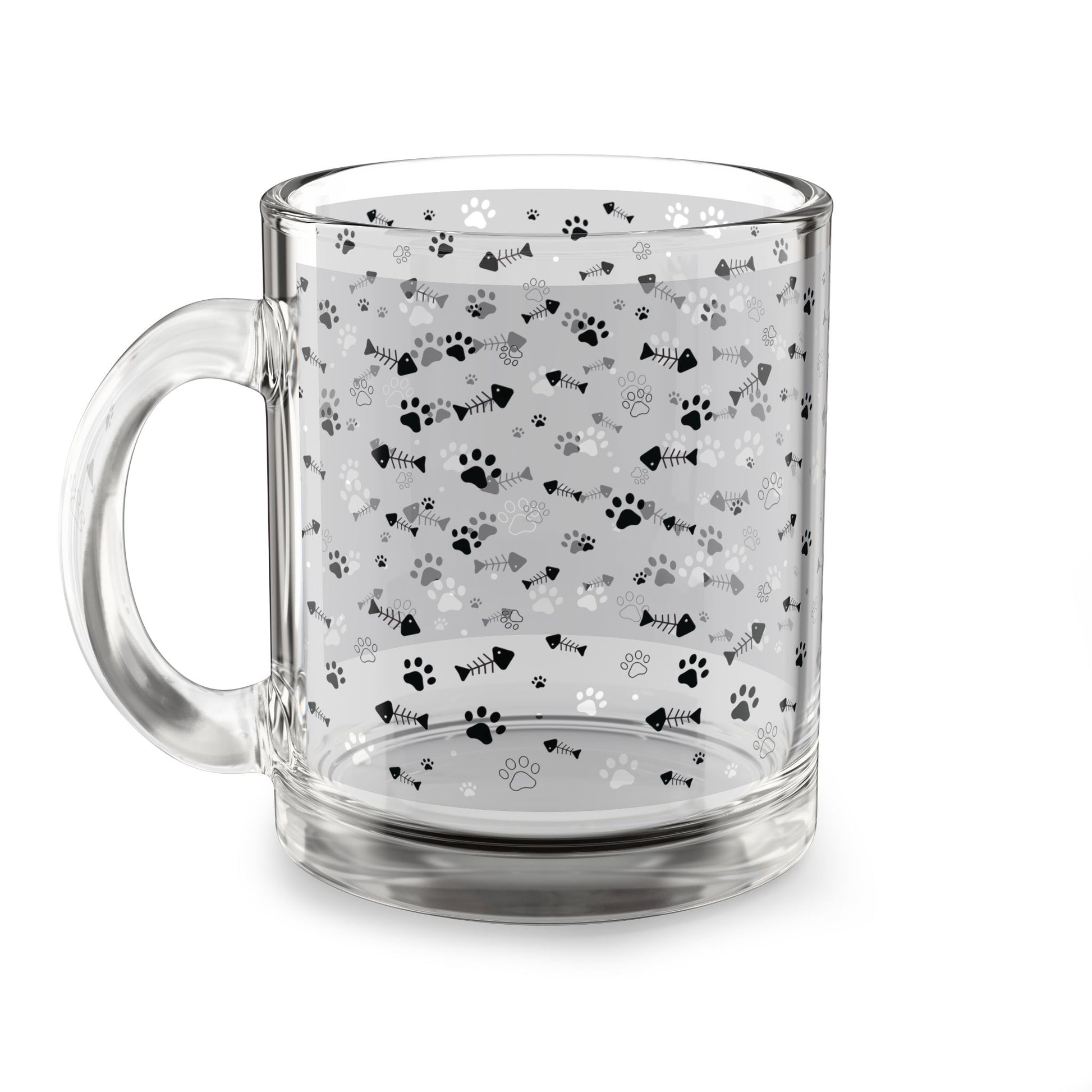 Clear glass mug with paw prints and fishbones all over print pattern.