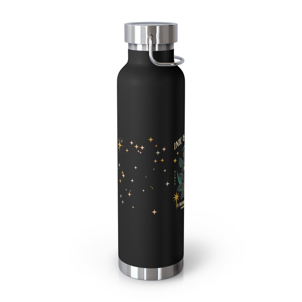 Sideview of a black water bottle with a star pattern design.