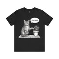 A black short-sleeve crewneck t-shirt featuring a black and white sketch of a cat sitting next to a potted plant with a speech bubble that says 'Nice plant.' on a plain white background.