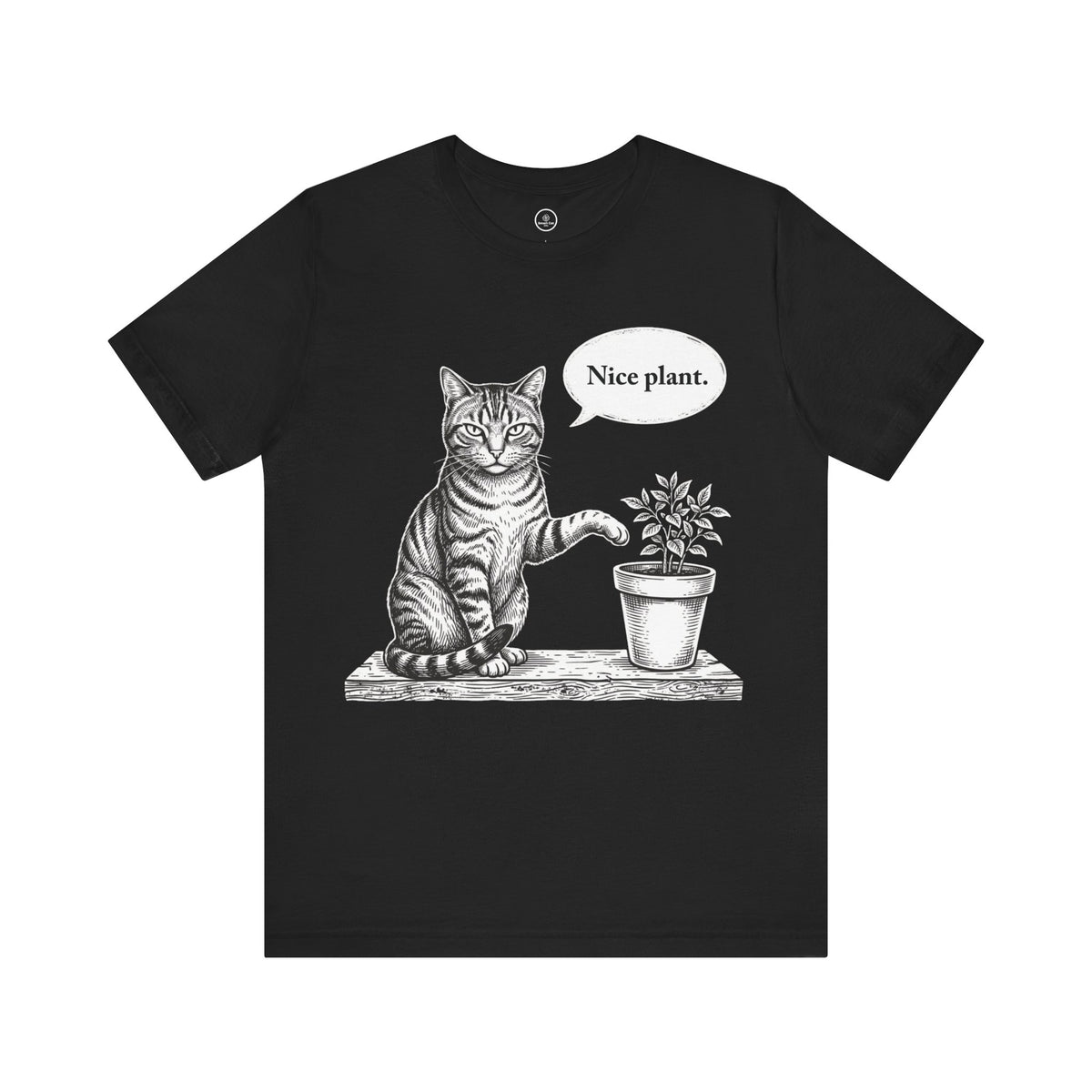 A black short-sleeve crewneck t-shirt featuring a black and white sketch of a cat sitting next to a potted plant with a speech bubble that says 'Nice plant.' on a plain white background.