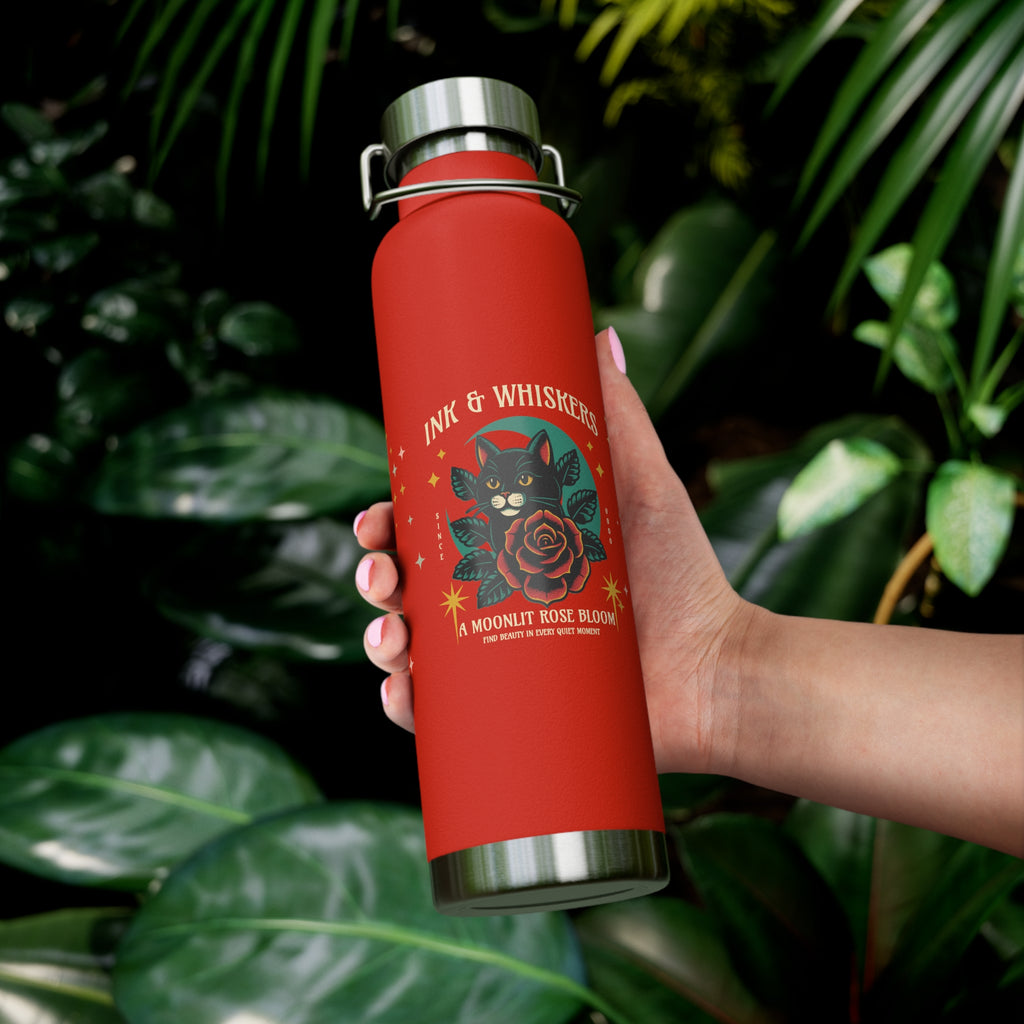 Red water bottle with cat and rose design, featuring the text 'Ink & Whiskers'.
