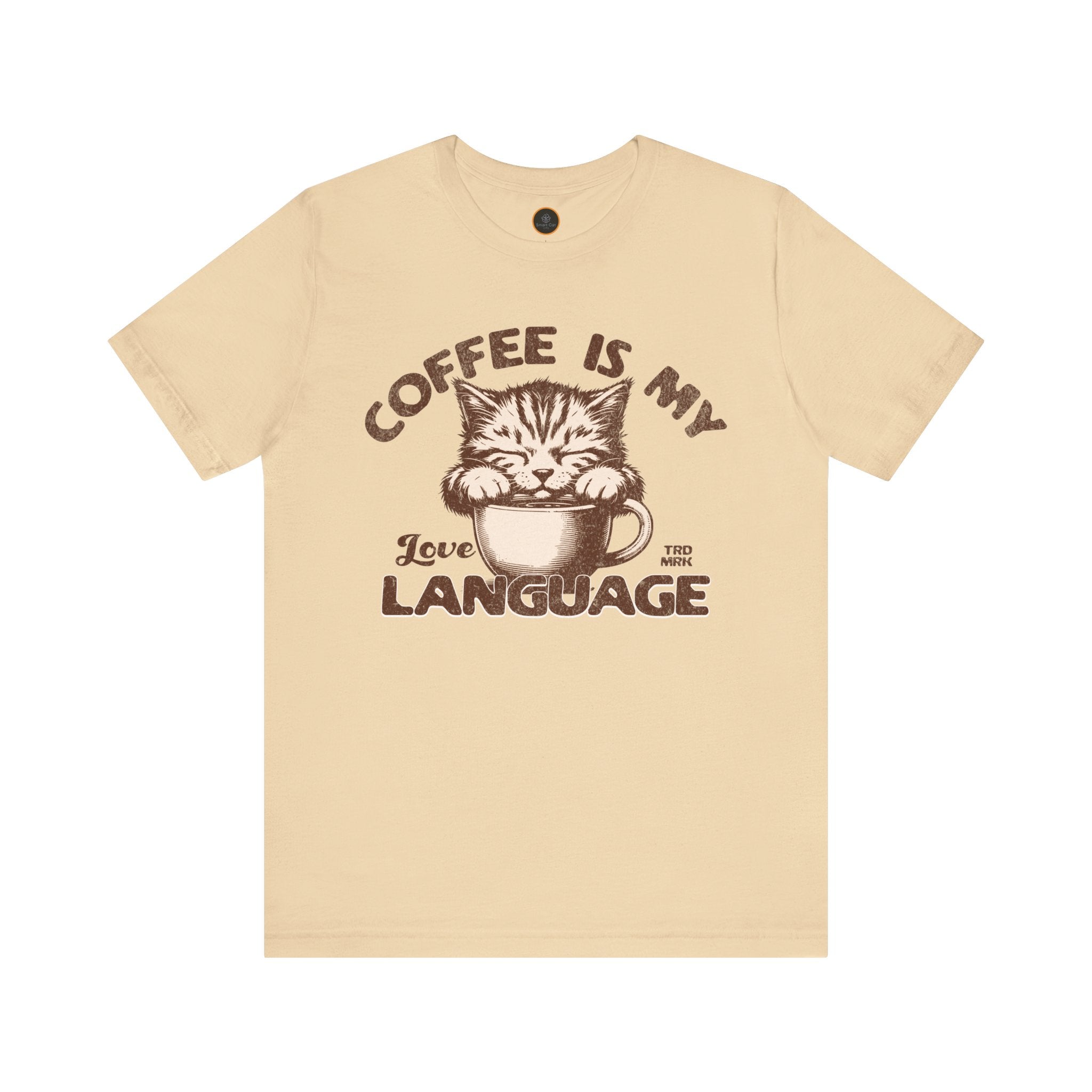 A  crew neck t-shirt with the text 'COFFEE IS MY LANGUAGE' and a graphic of a cat.