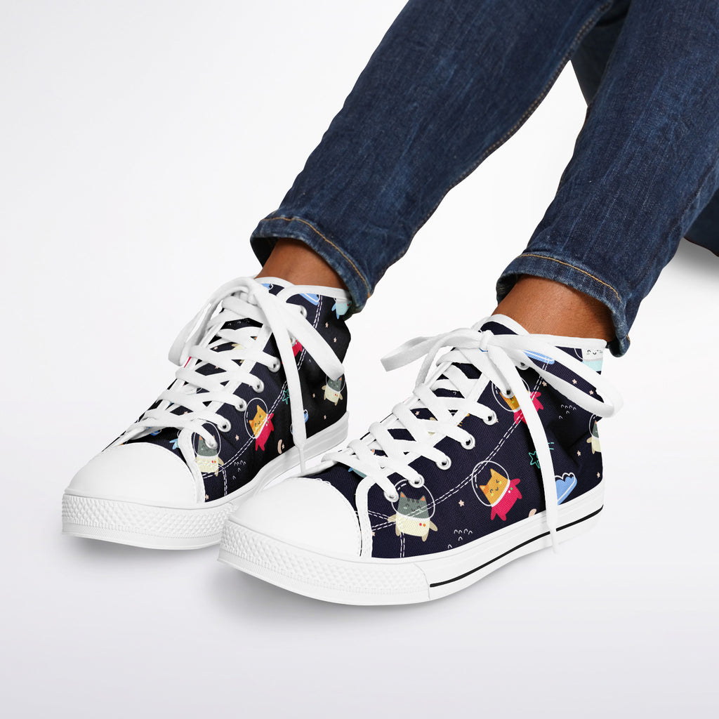 Astro Kitty sneakers: dark blue background with floating cartoon cats in space helmets, crescent moons, stars, fishbones, and flowers pattern.