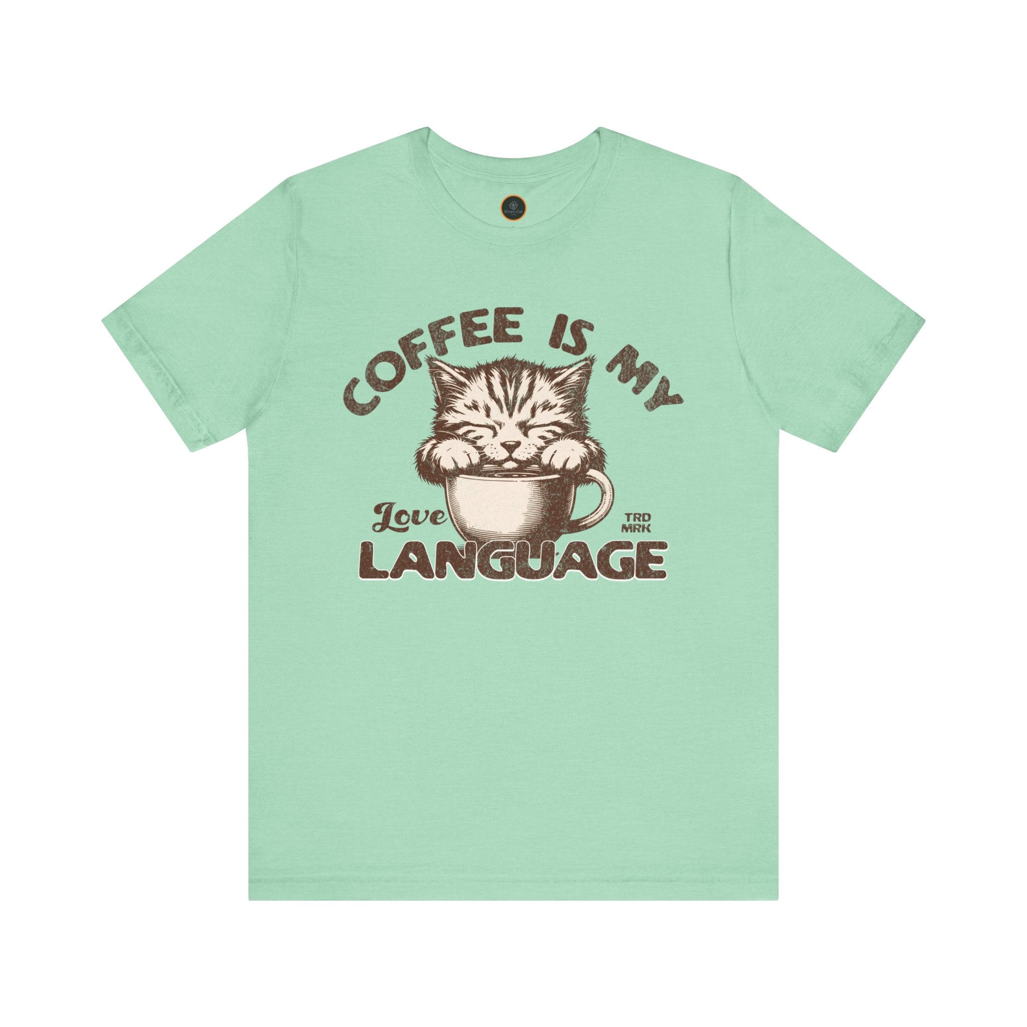 A  crew neck t-shirt with the text 'COFFEE IS MY LANGUAGE' and a graphic of a cat.