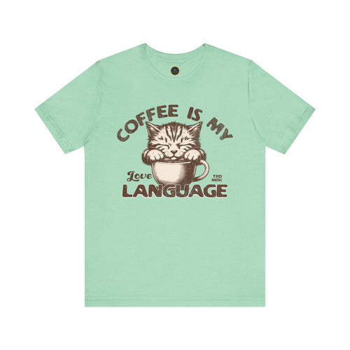 A  crew neck t-shirt with the text 'COFFEE IS MY LANGUAGE' and a graphic of a cat.
