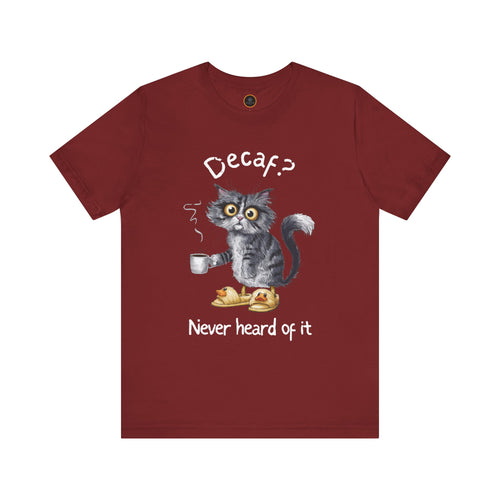 A red crew neck t-shirt featuring an exhausted-looking cat wearing yellow slippers with duck faces on them. The cat is holding a steaming mug of coffee. The text on the sweatshirt reads "Decaf? Never Heard of It."