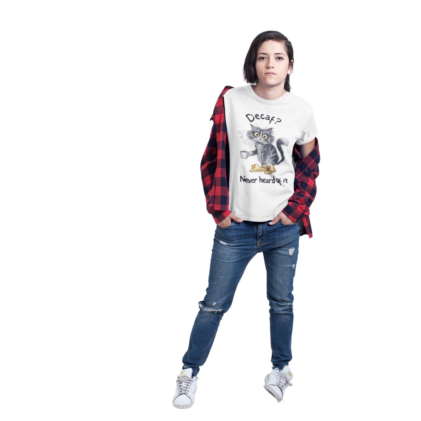 A model wearing a white crew neck t-shirt featuring an exhausted-looking cat wearing yellow slippers with duck faces on them. The cat is holding a steaming mug of coffee. The text on the sweatshirt reads "Decaf? Never Heard of It."